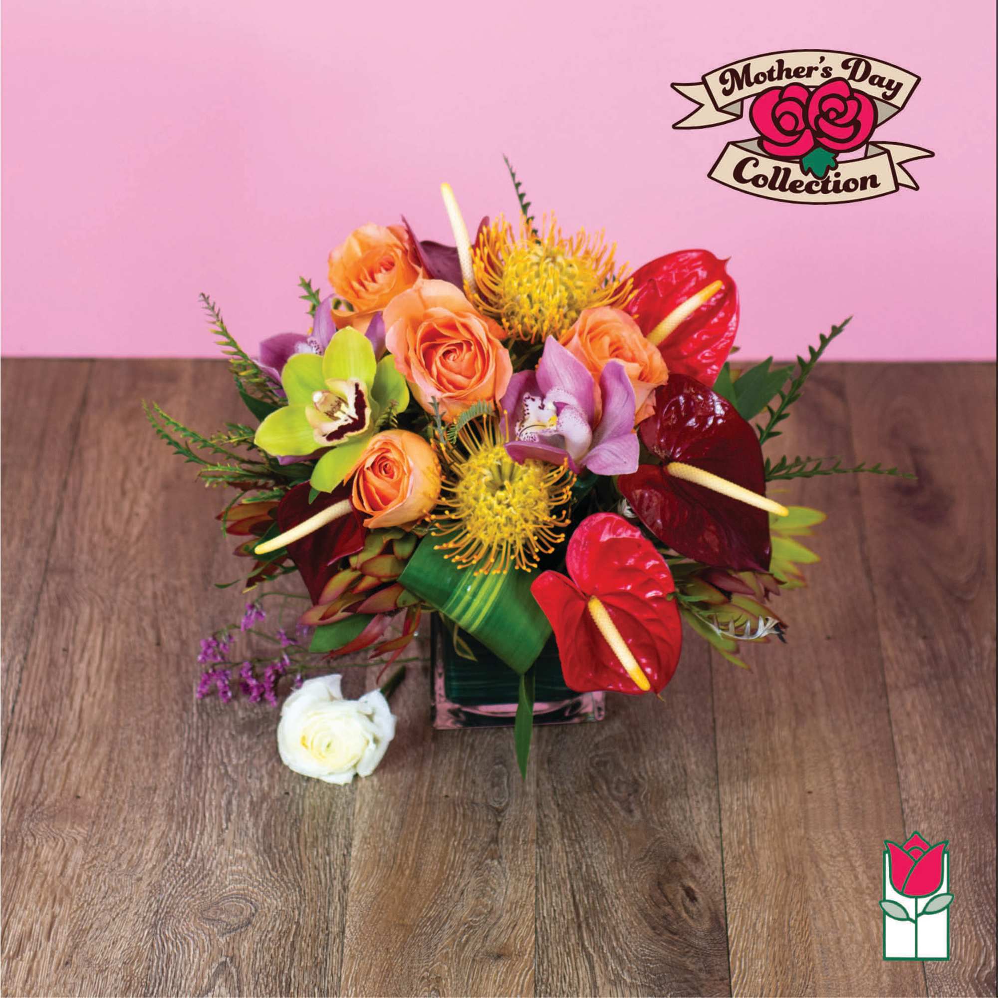 Mixed bouquet with orange roses, orchids, and red anthuriums in a vase
