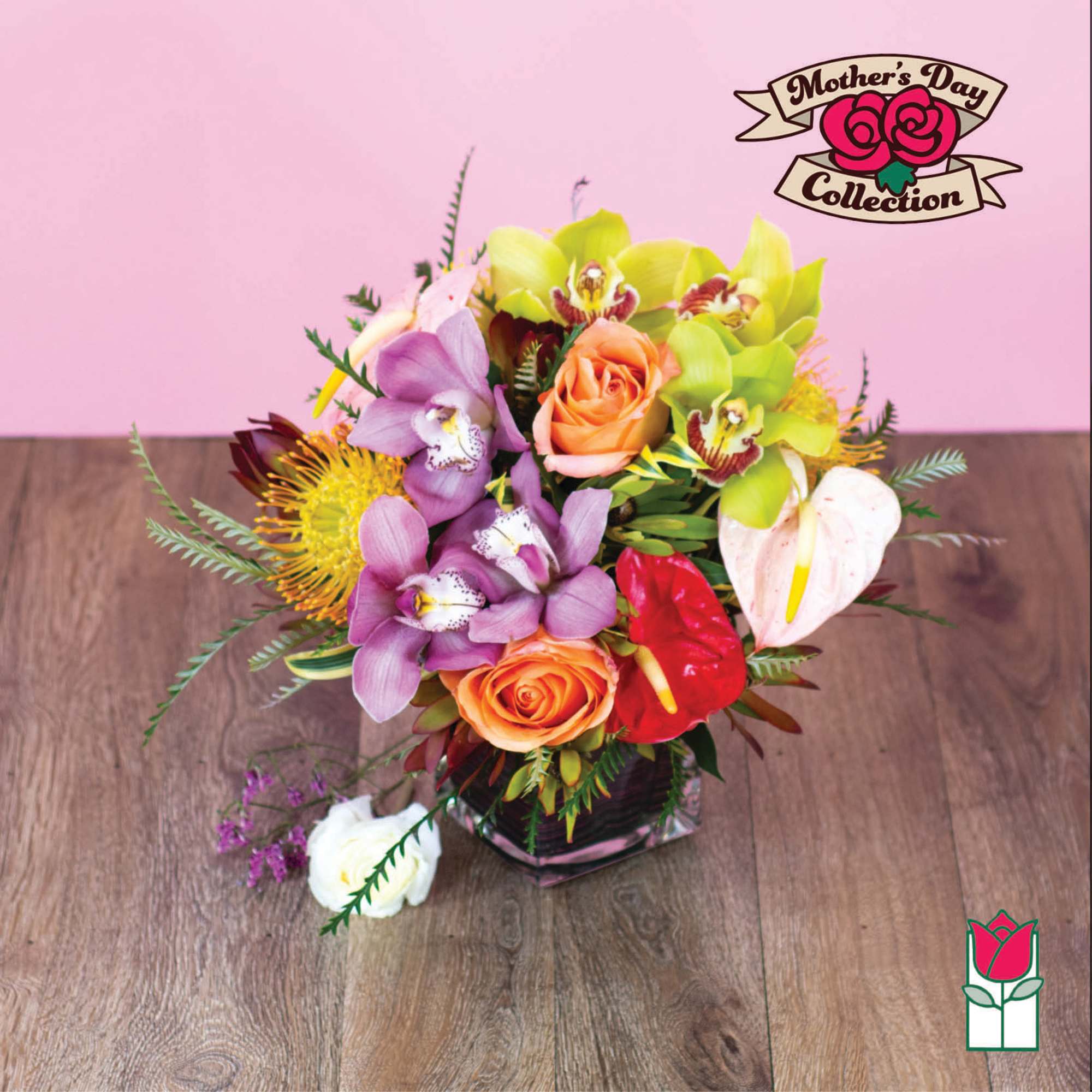 Mixed bouquet with orchids, roses, and anthuriums in a glass vase
