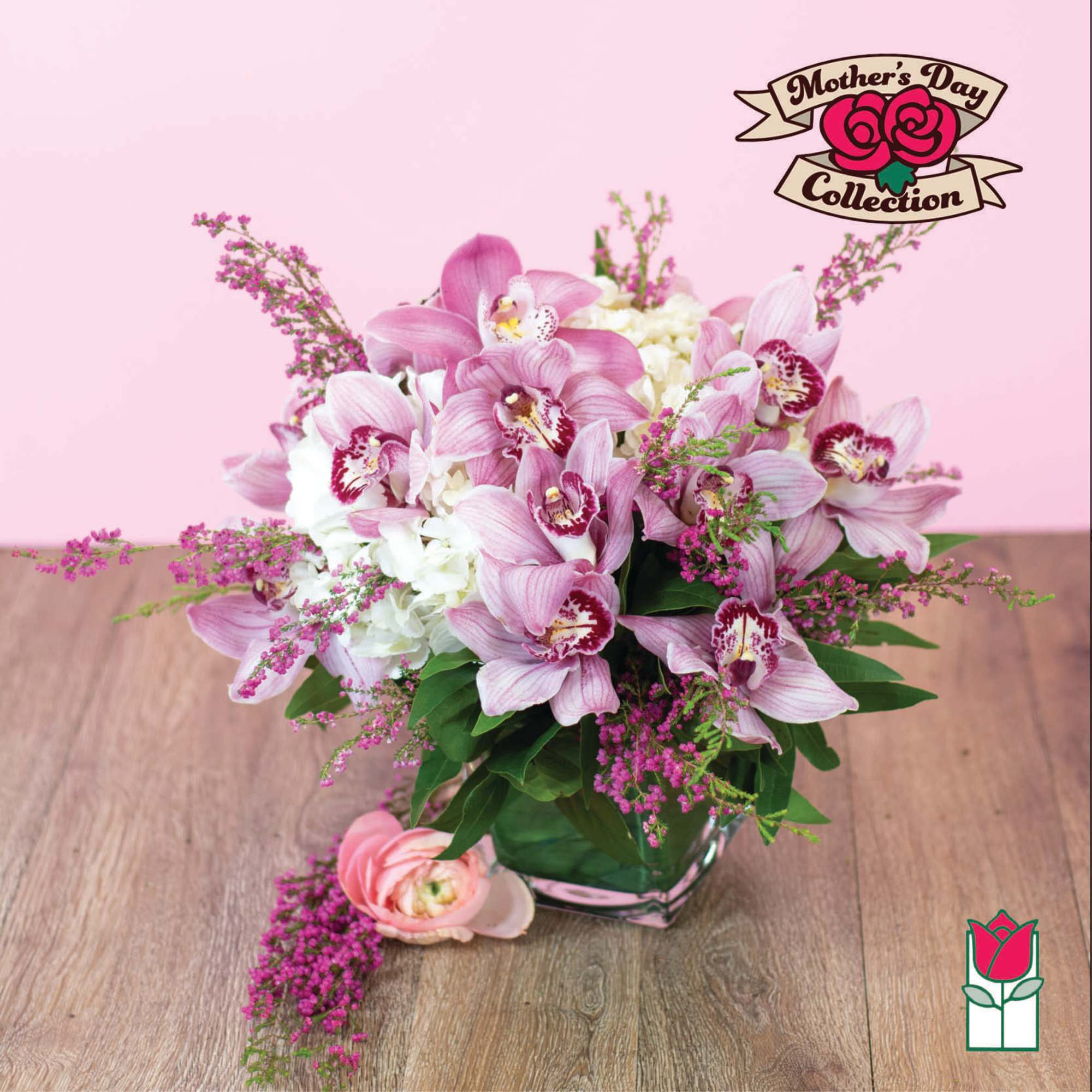 Pink orchids and white hydrangeas in a glass vase