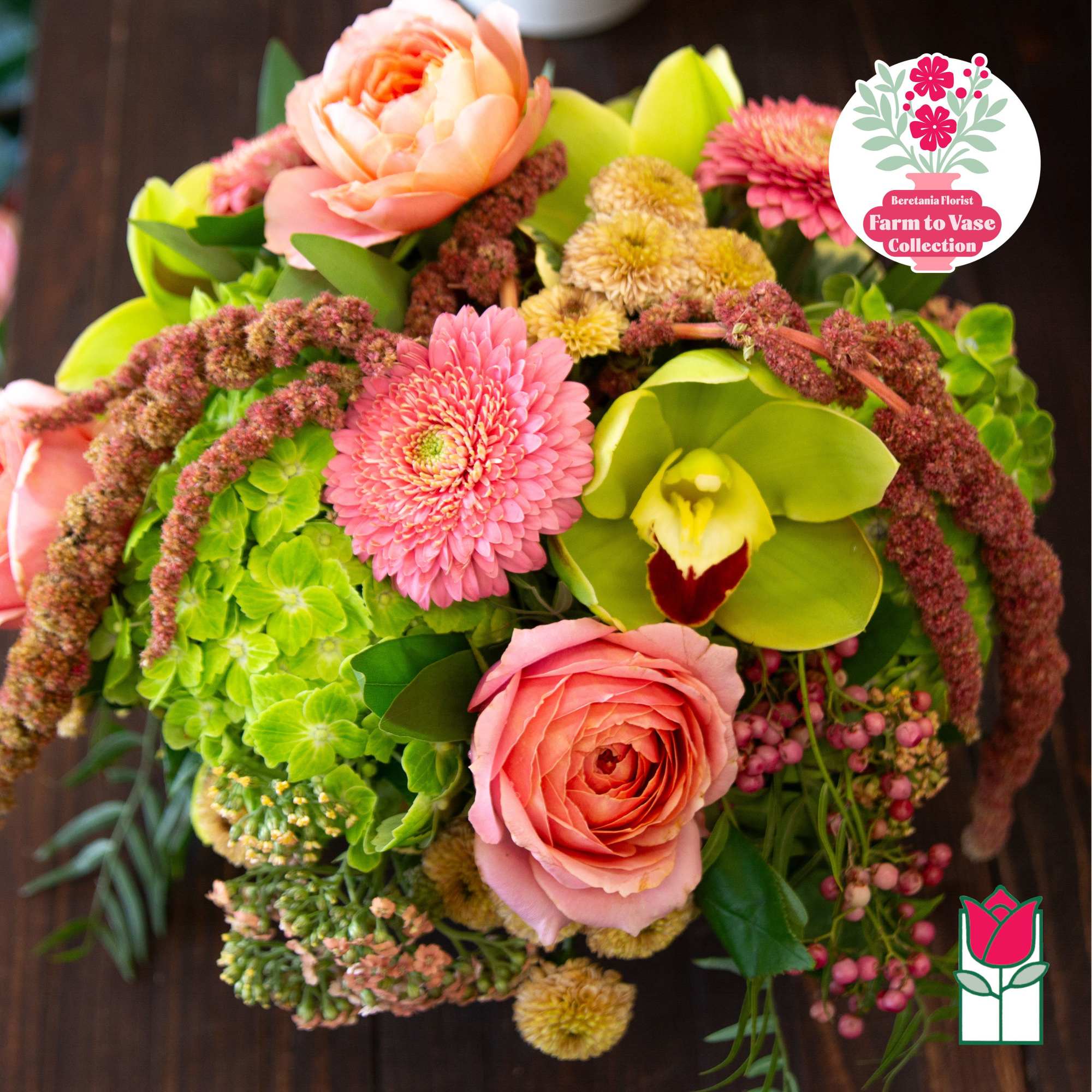 Bouquet with pink roses, green hydrangea, and a green orchid