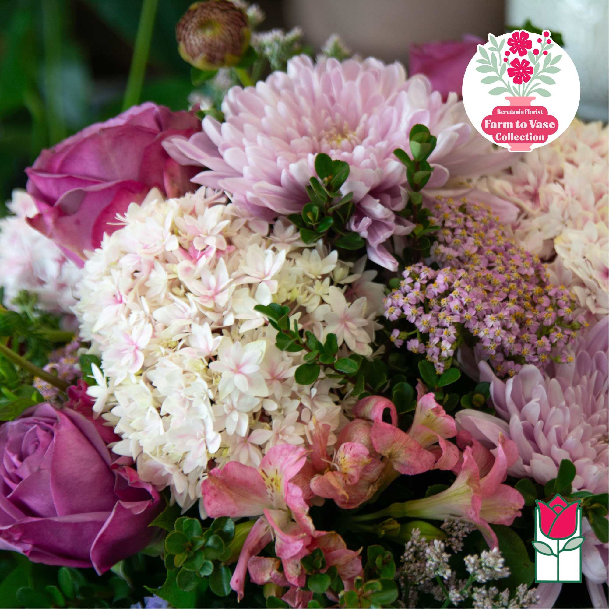 Bouquet of pink roses, pale chrysanthemums, and small pink flowers