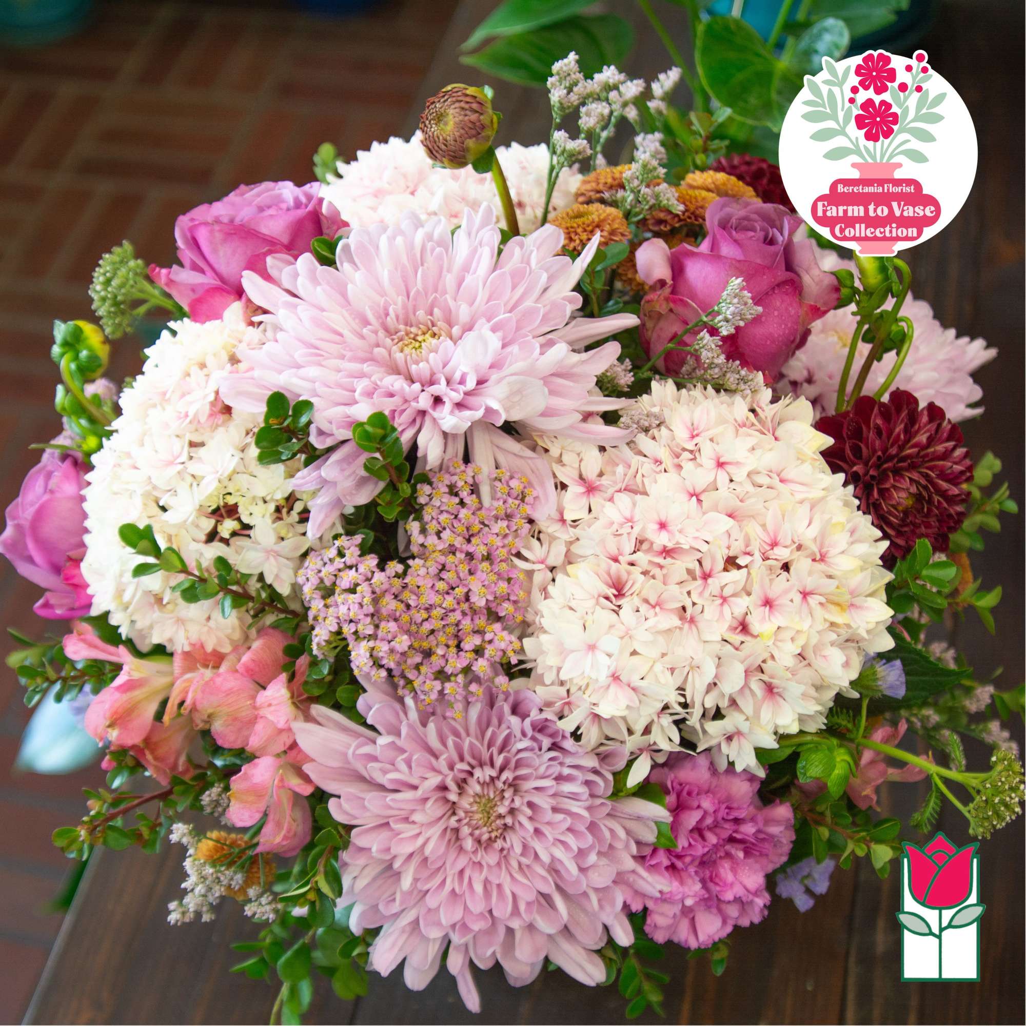 Mixed bouquet of pink and white flowers with large chrysanthemums