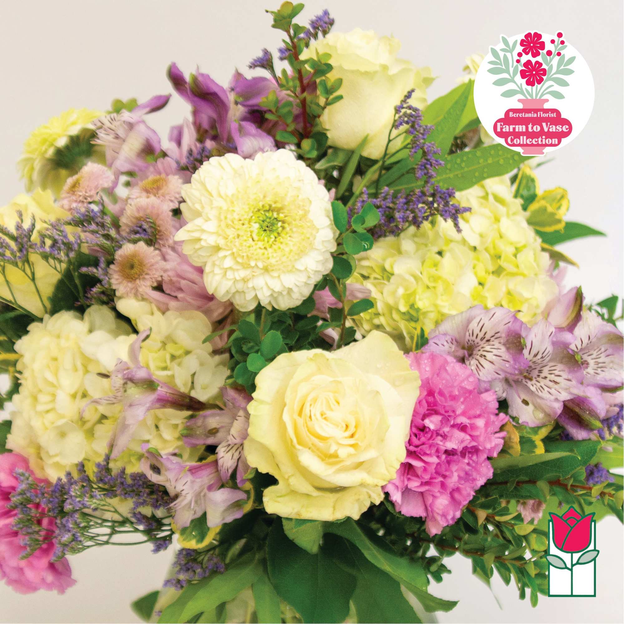 Bouquet of pale yellow roses, hydrangeas, and purple flowers