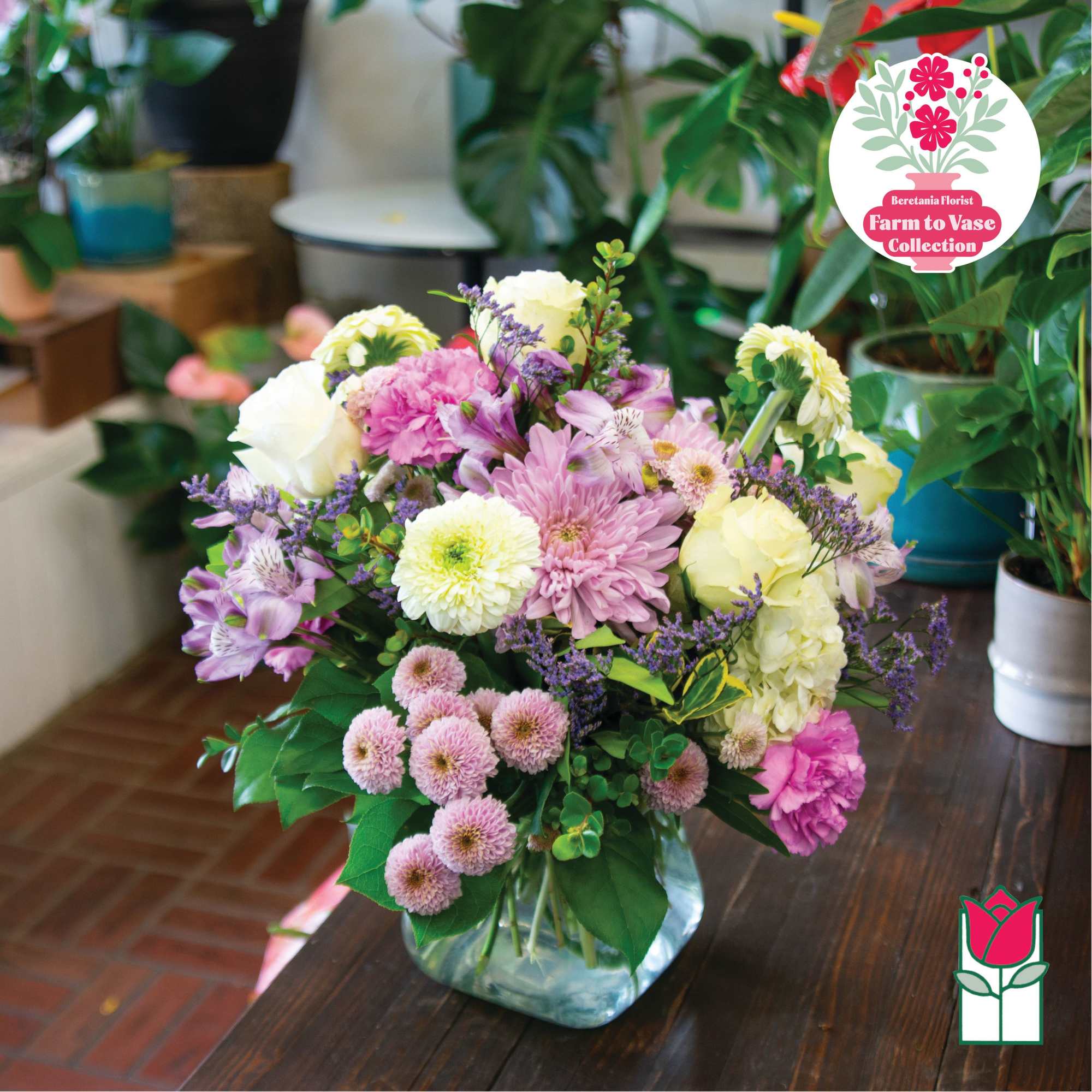 Mixed pastel bouquet in a clear glass vase