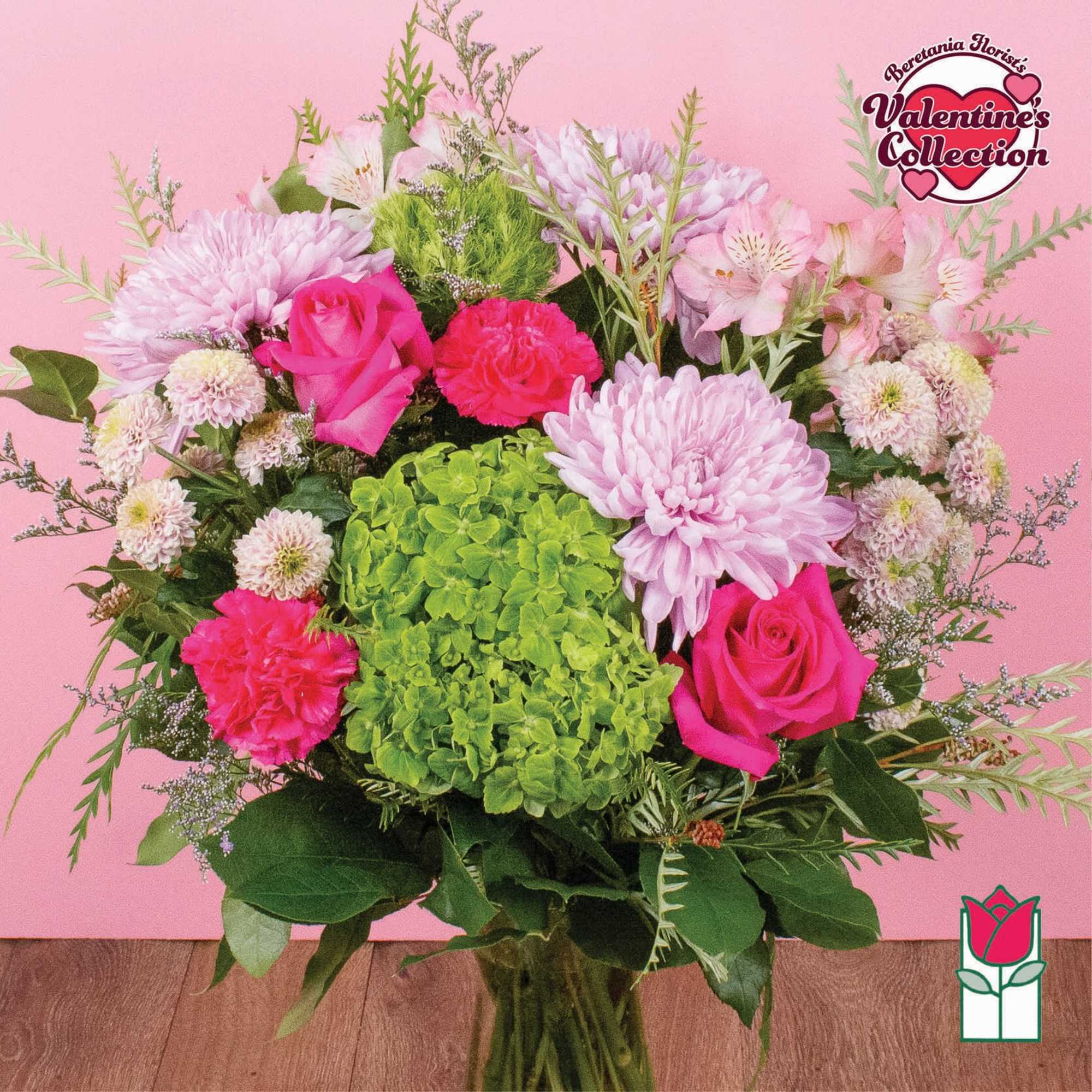Pink and green mixed bouquet with roses, chrysanthemums, and hydrangea in a vase