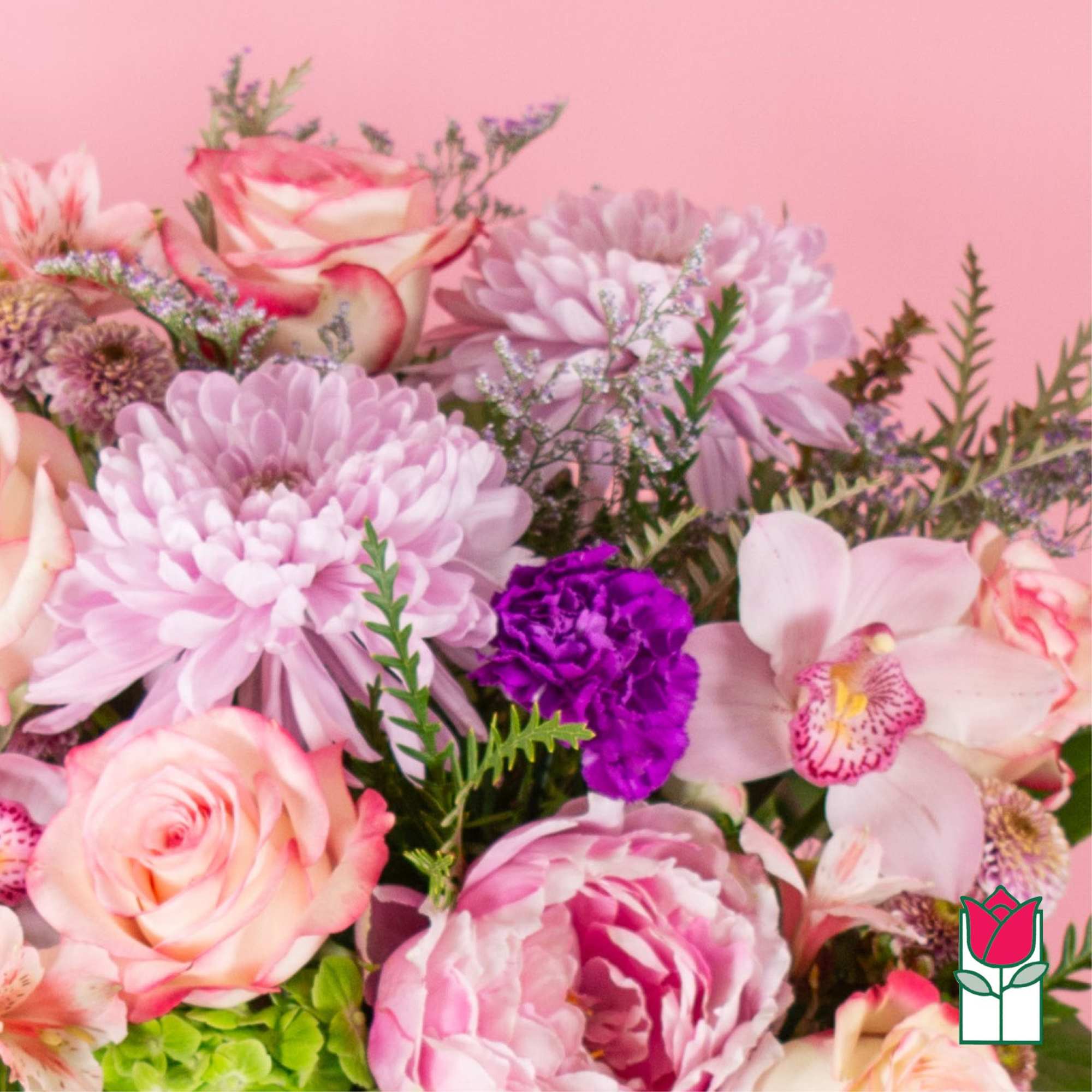 Pink and peach bouquet with roses, orchids, and chrysanthemums