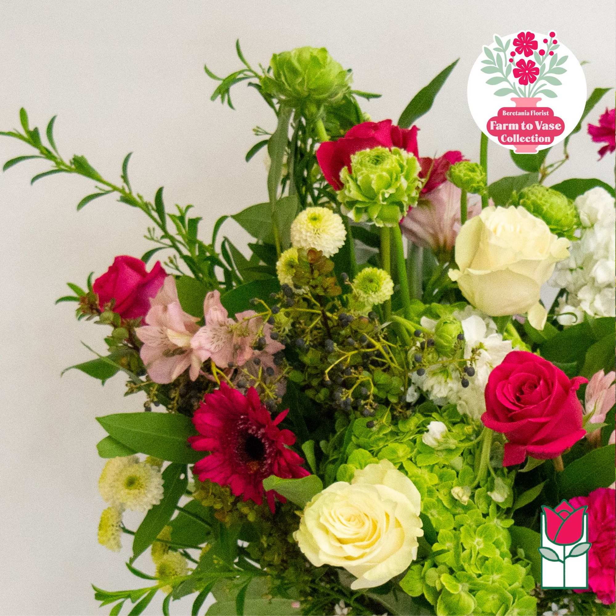 Mixed bouquet with pink and white roses and green blooms