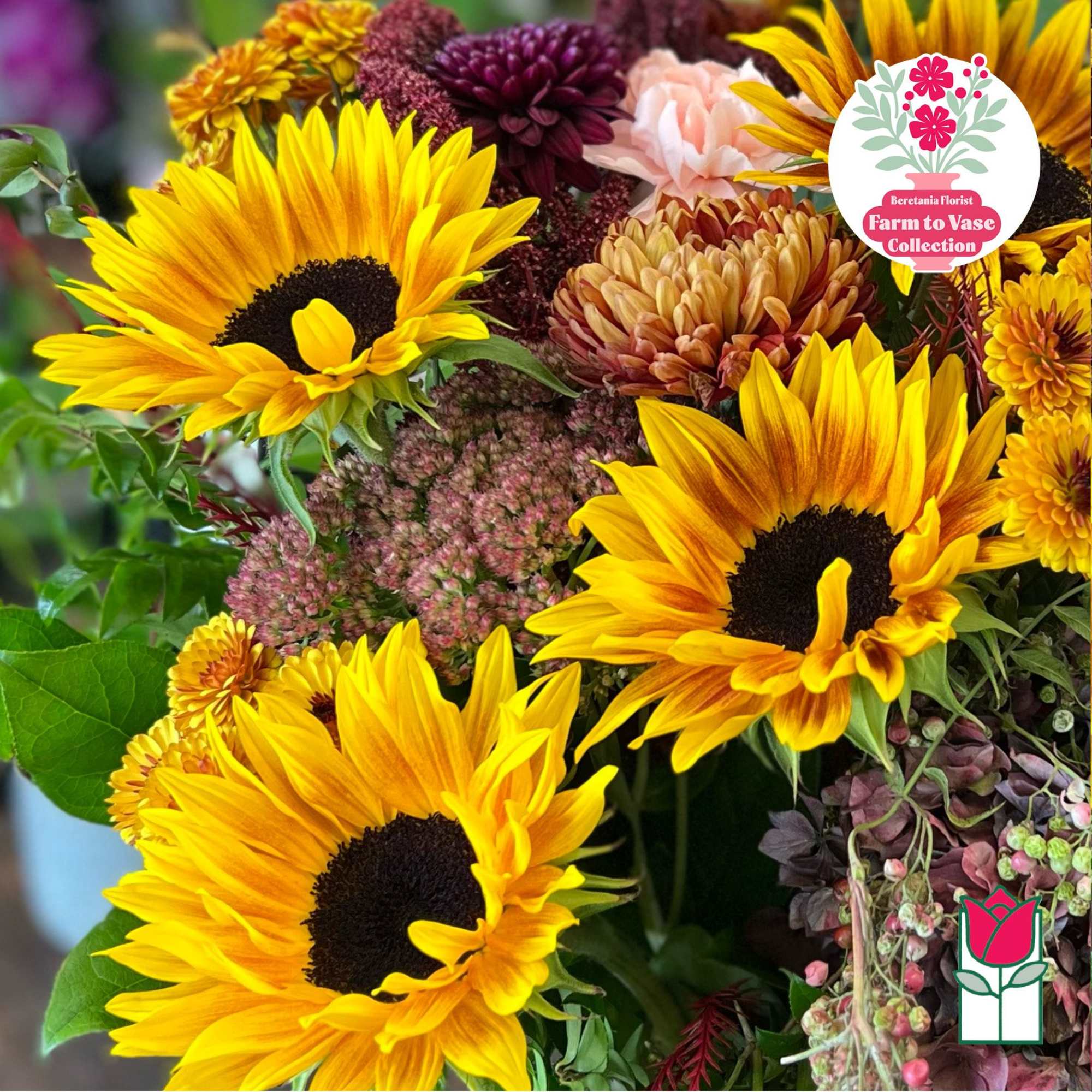 Bouquet of bright sunflowers with mixed autumn blooms