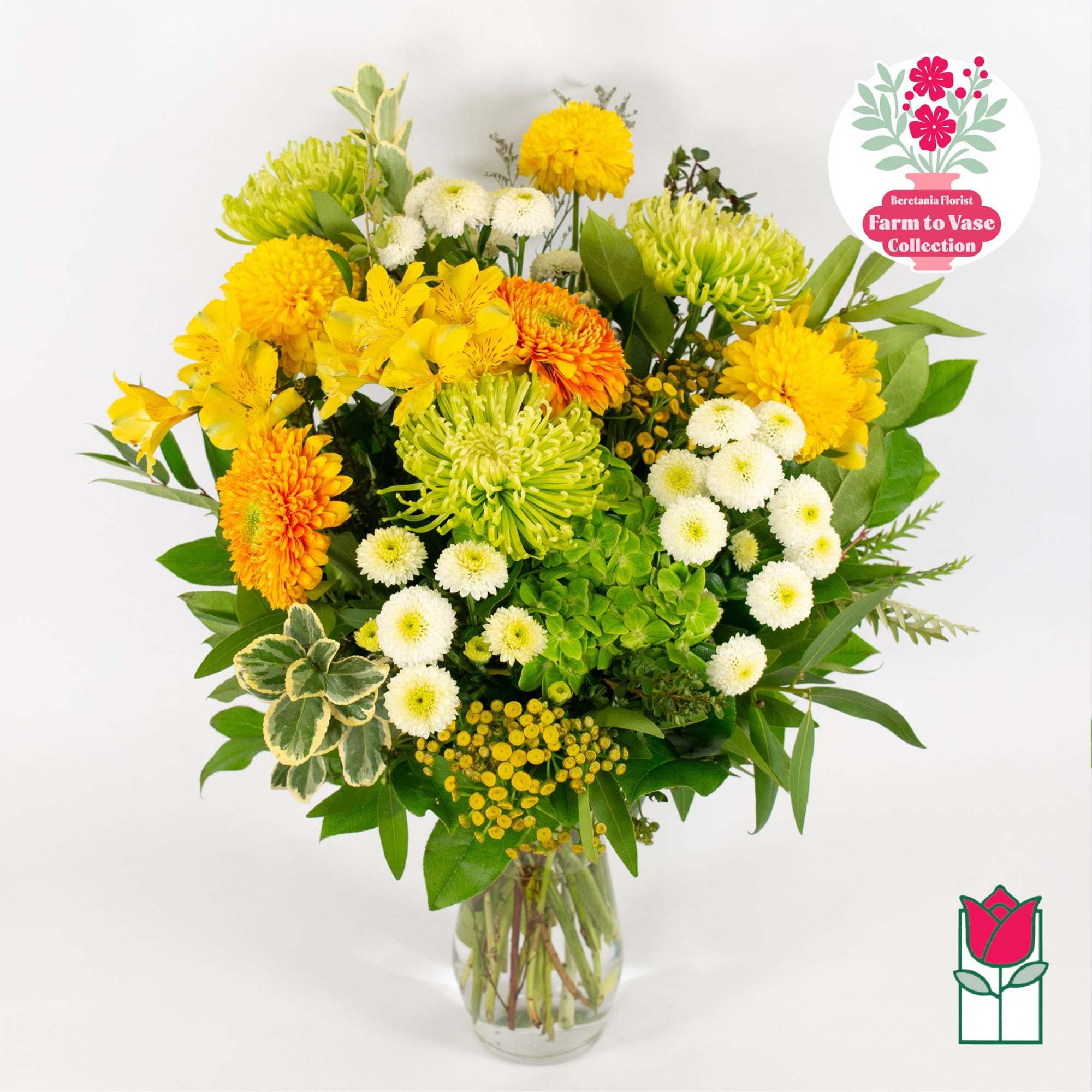 Yellow and white mixed bouquet in a clear glass vase