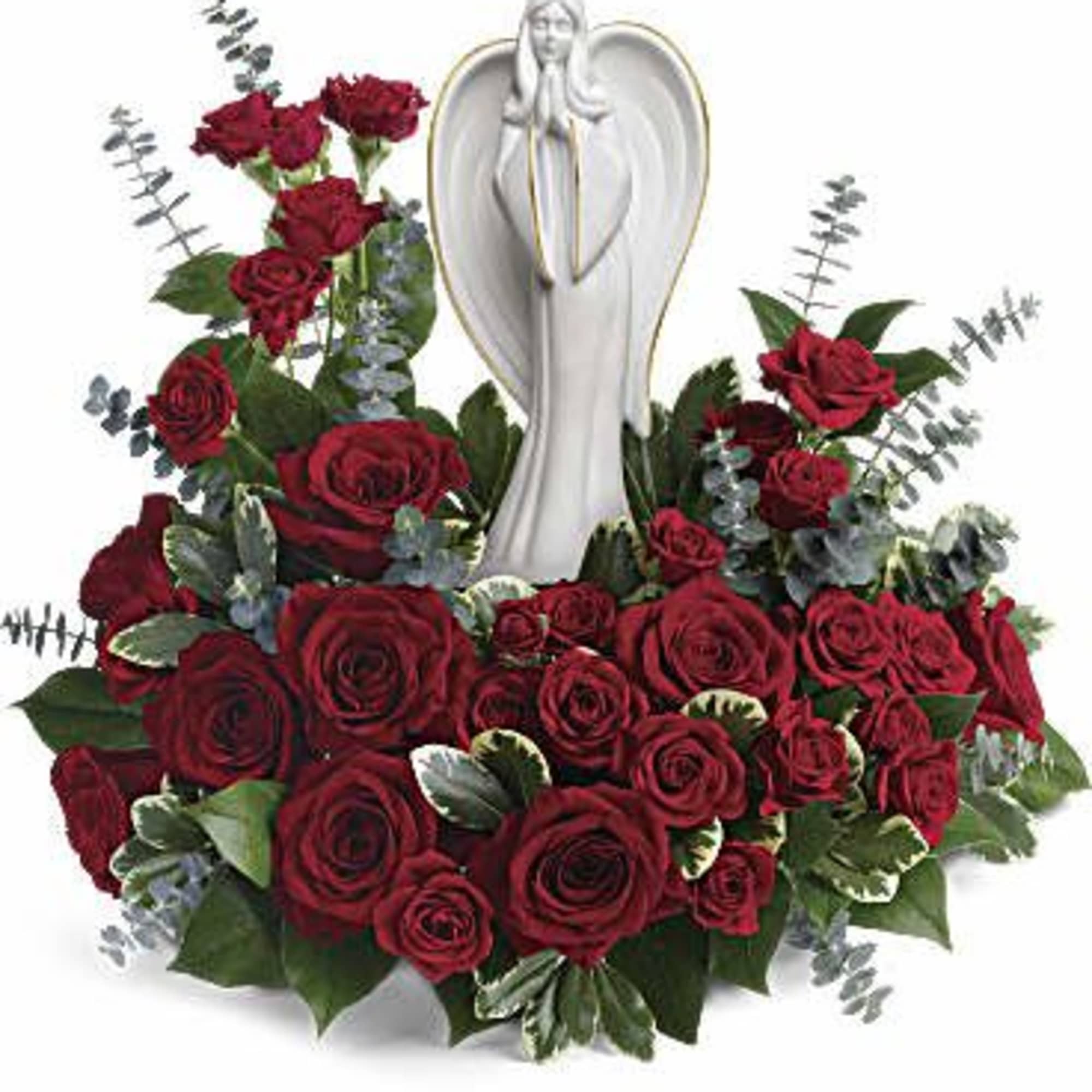 Sympathy arrangement of red roses surrounding a white angel figurine.