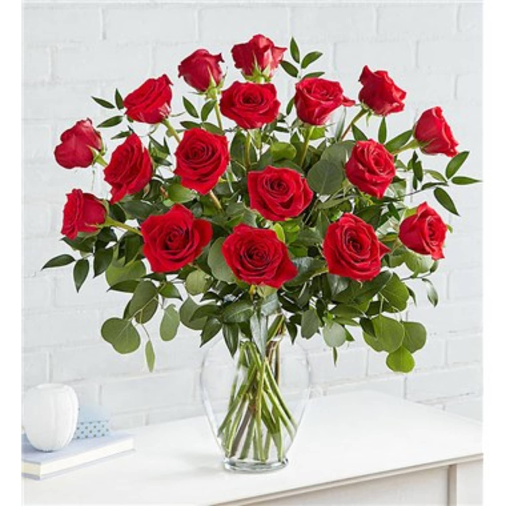 Bouquet of red roses in a clear glass vase