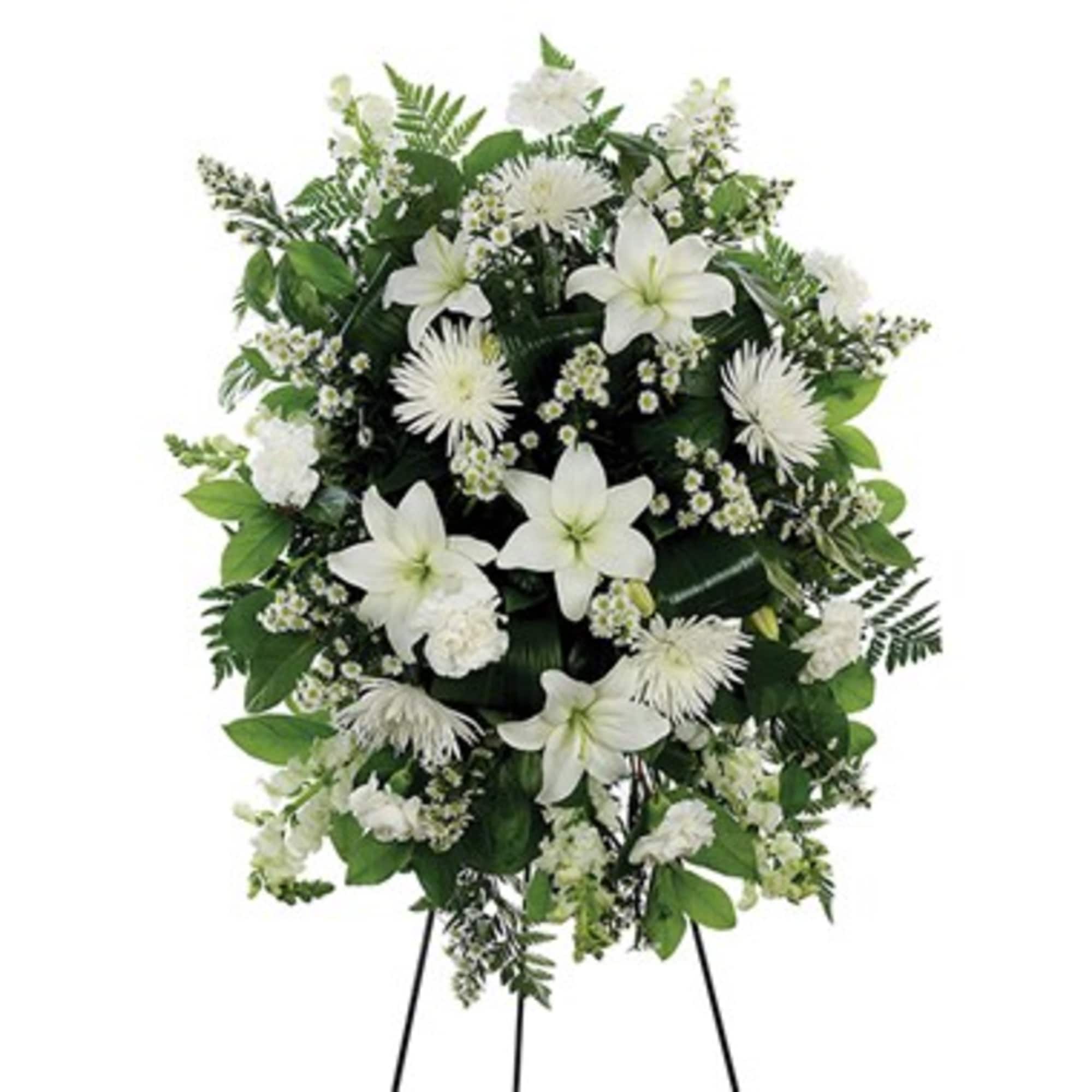 White floral standing spray on a black easel