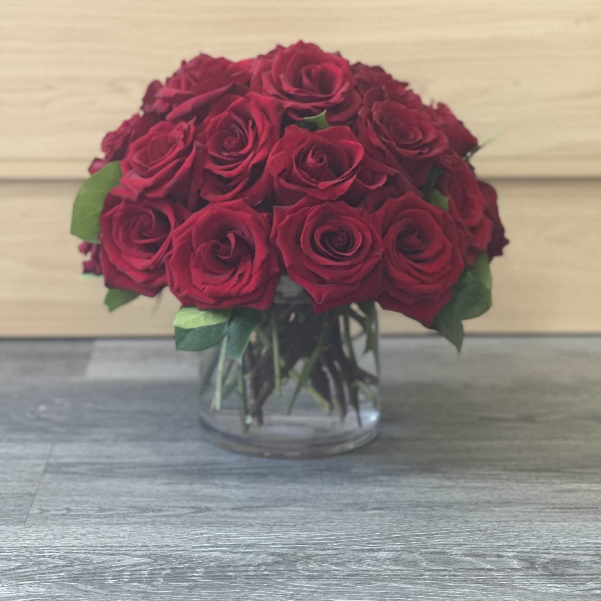 Bouquet of red roses in a clear glass vase