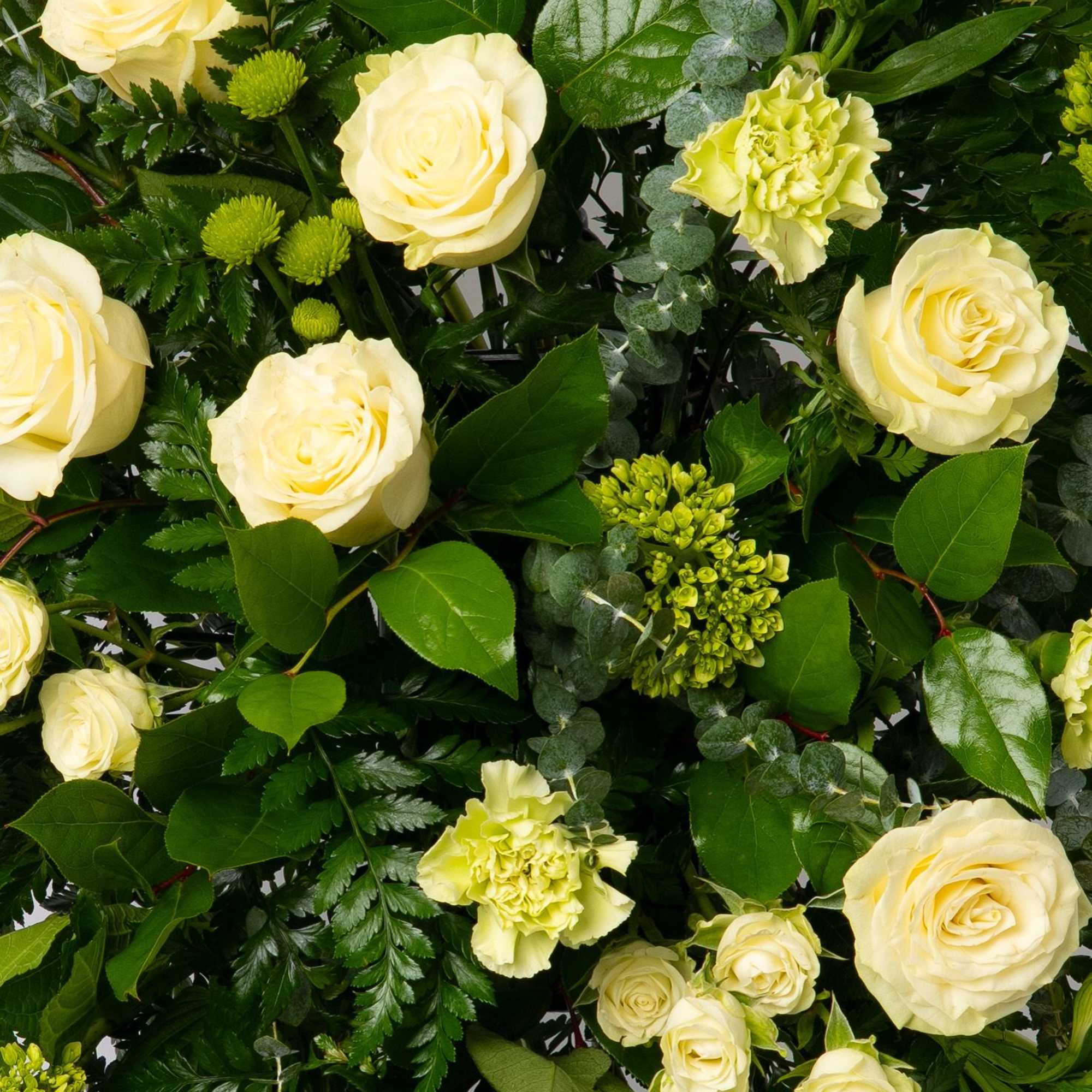 Elegant and timeless, this white and green spray offers a clean, natural