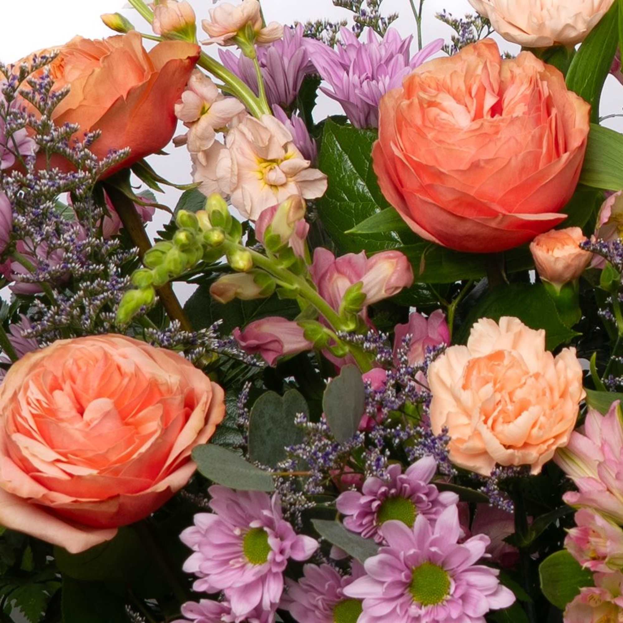 Soft and expressive, this large, pastel casket spray offers a gentle and