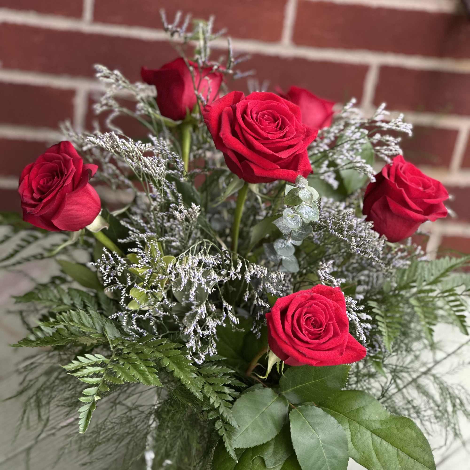 Half a dozen red roses in a clear glass vase to say, photo 2 of 2