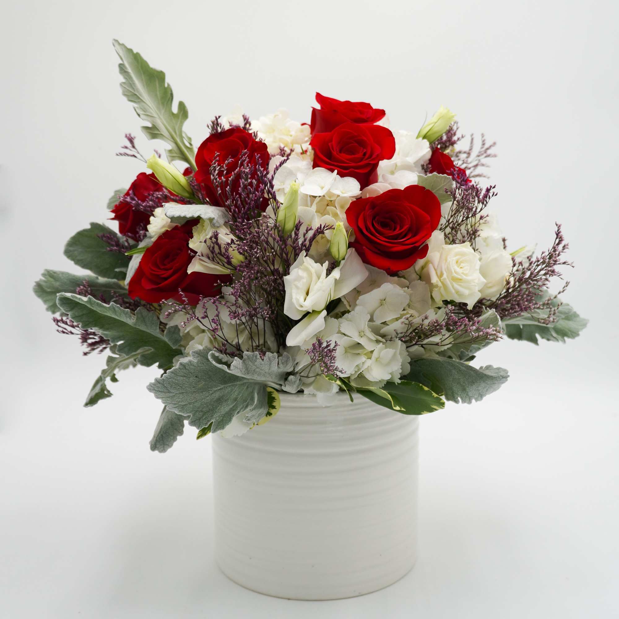 Send red roses, white hydrangeas, dusty miller and white lisianthus  Bouquet