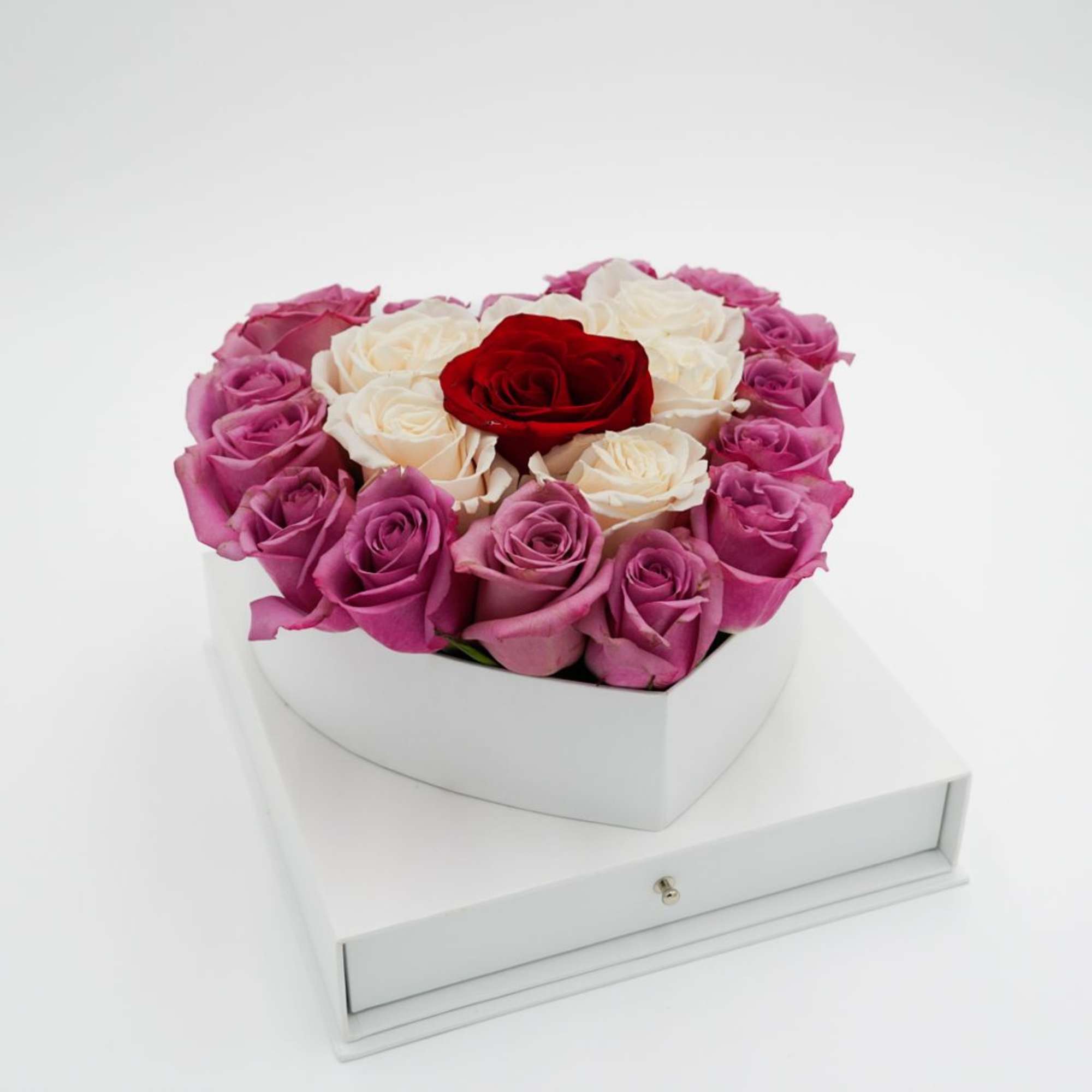 Heart-shaped box of pink, white, and red roses