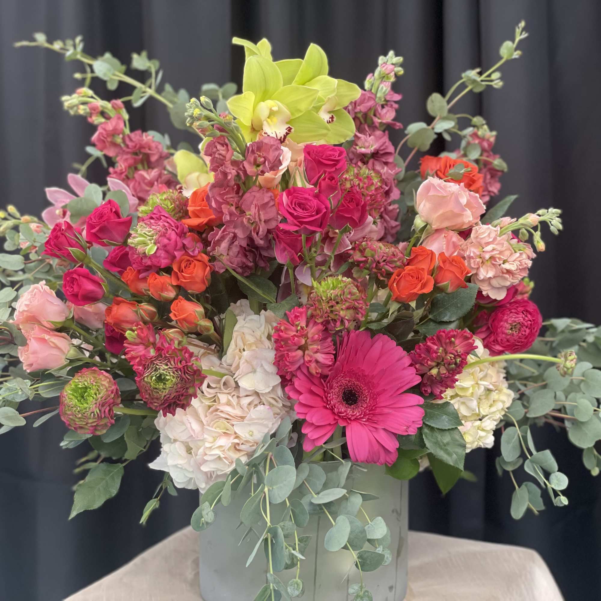 Paradise in Bloom is a vibrant, high-end arrangement bursting with tropical elegance