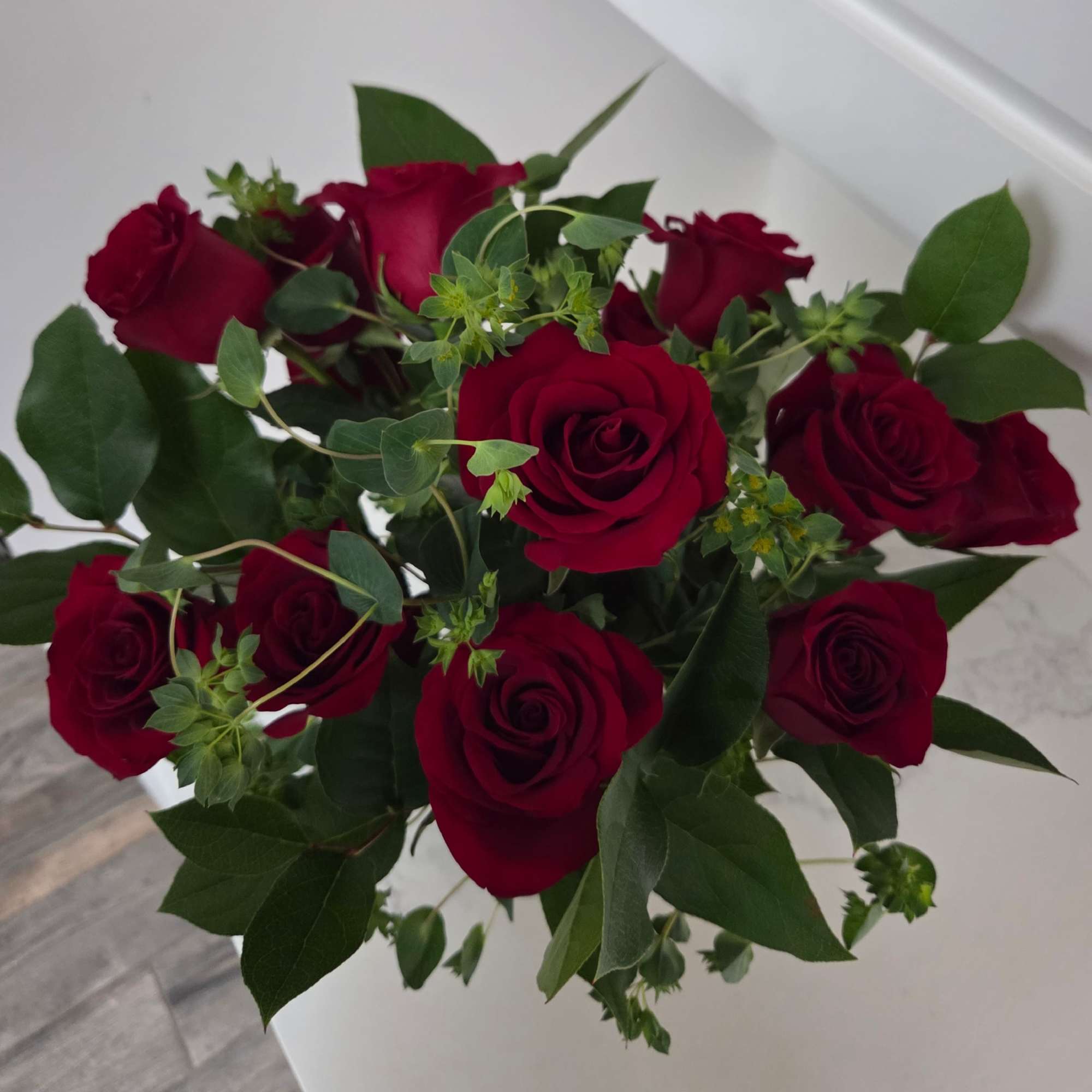 A classic! Contains one dozen long stemmed red roses and green filler., photo 2 of 2