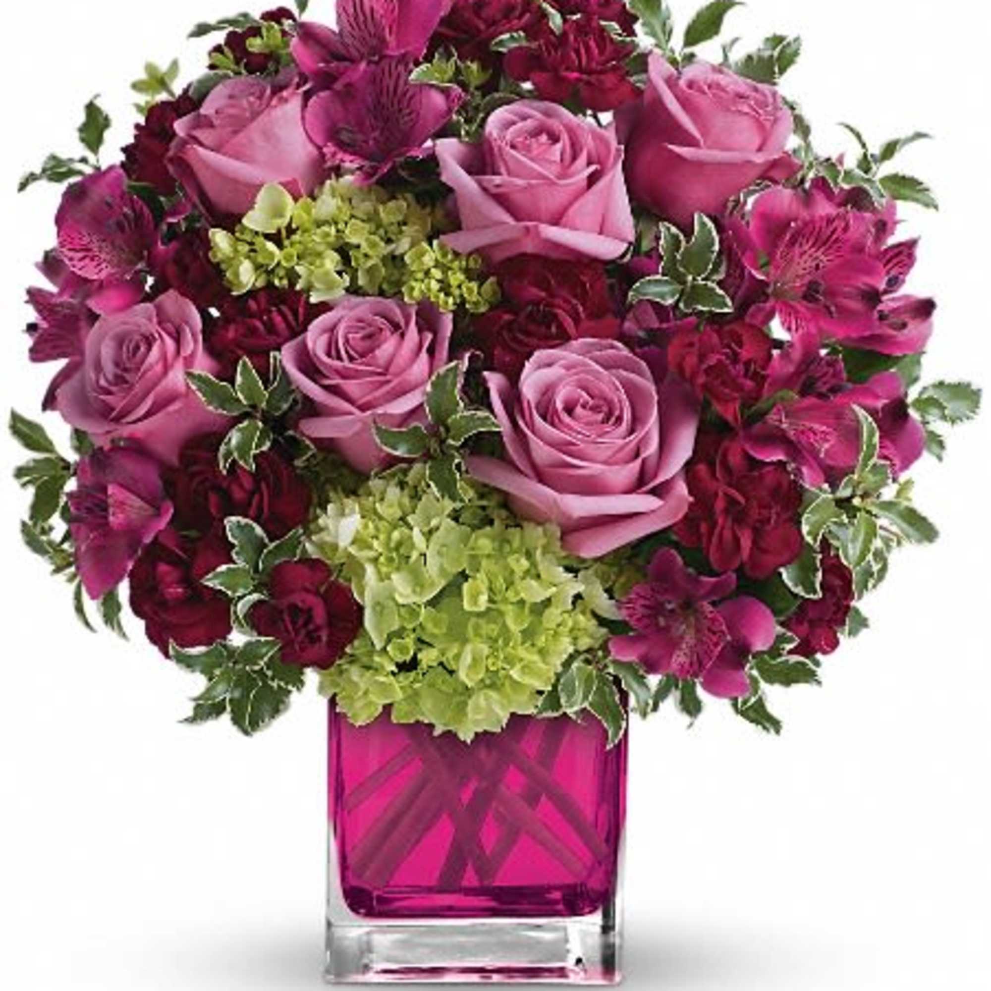 Pink and magenta roses with alstroemeria in a square glass vase