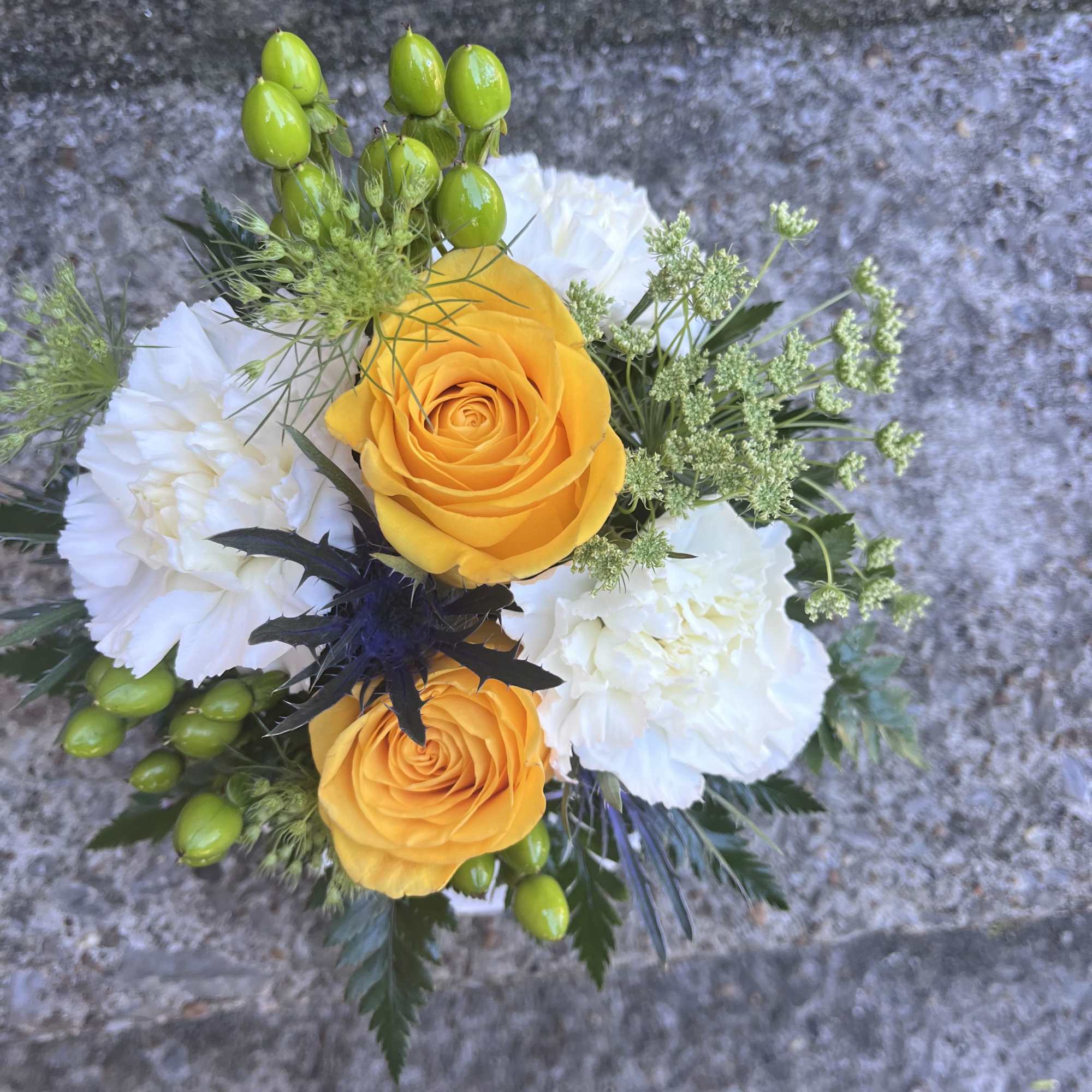 This cute arrangement has queen Ann&rsquo;s lace, yellow roses, thistle, hypericum and, photo 2 of 2
