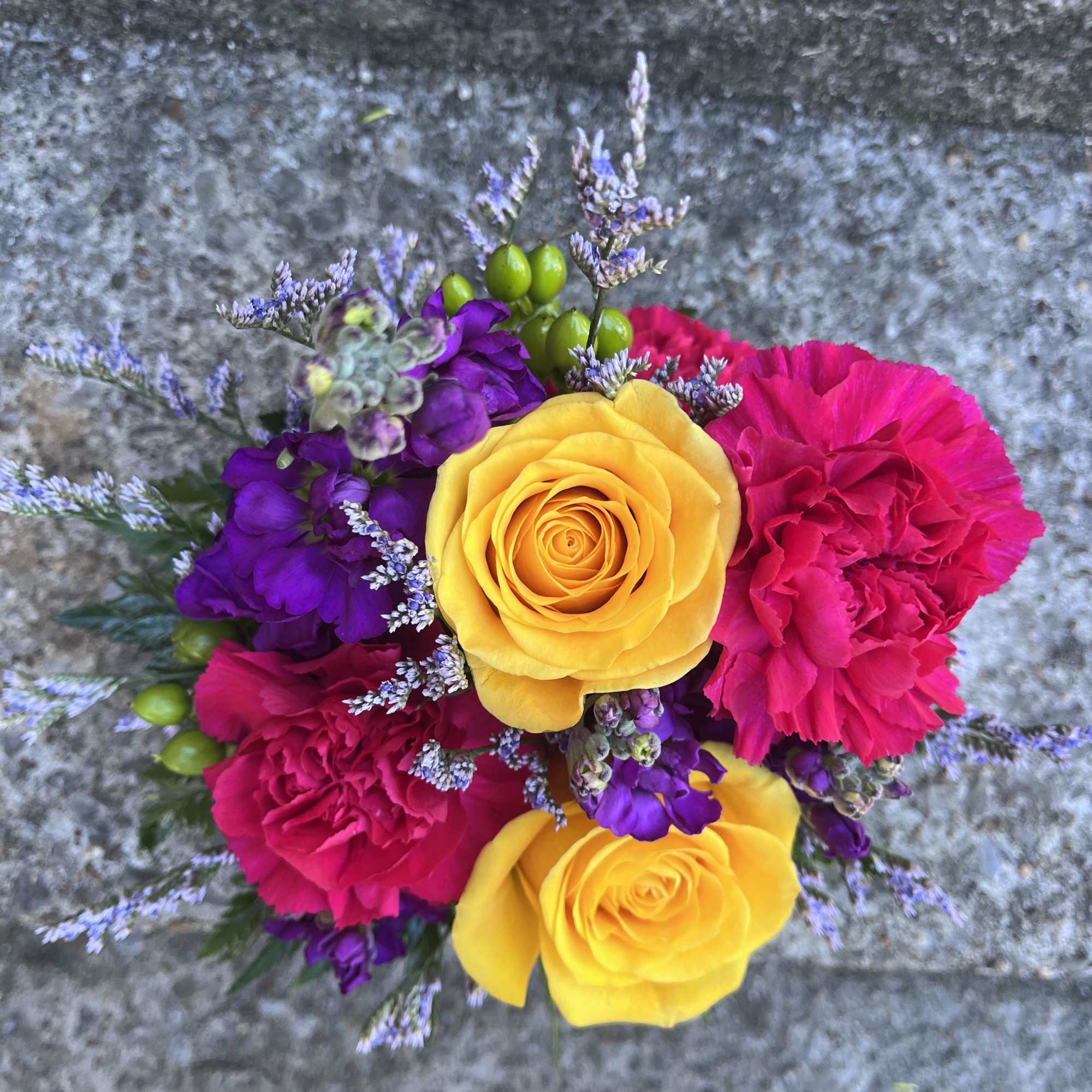 This arrangement has roses, stock, hypericum, limonium, carnations and greenery. , photo 2 of 2