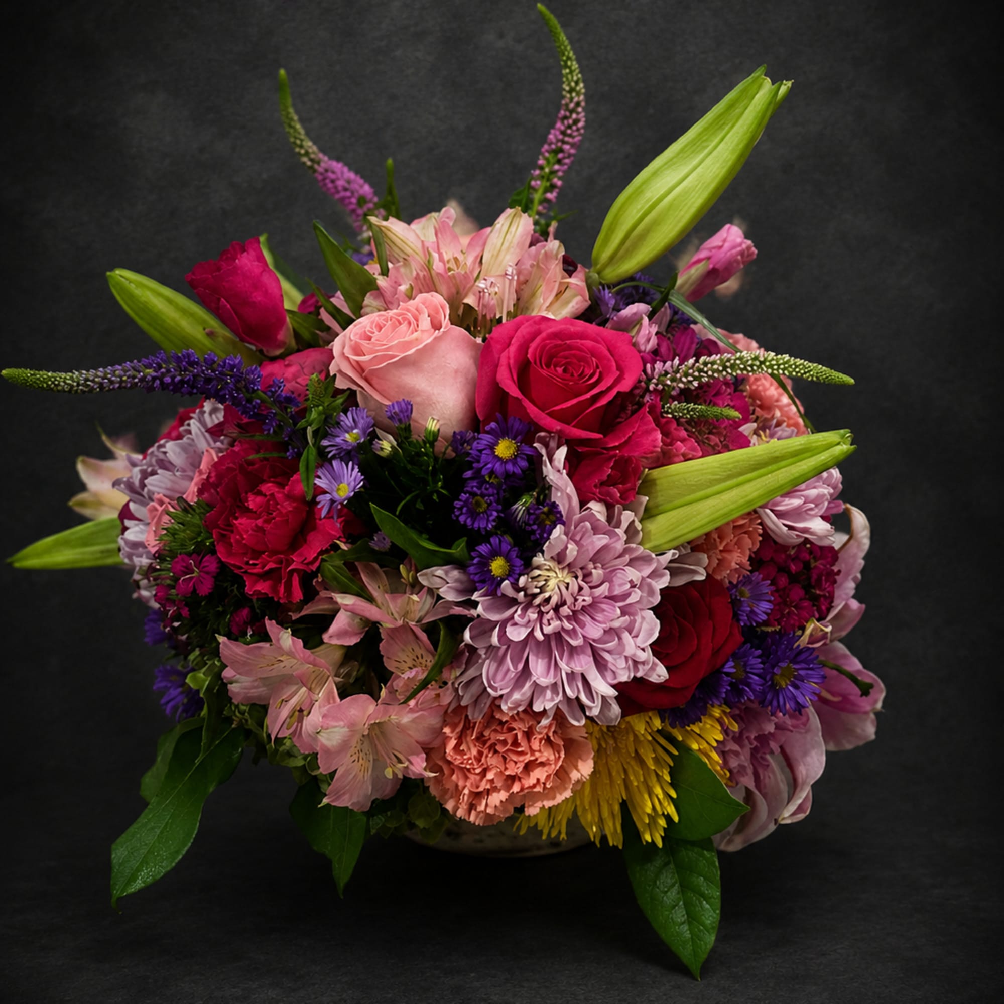 Lush, romantic, and packed with color, this flower arrangement is a low