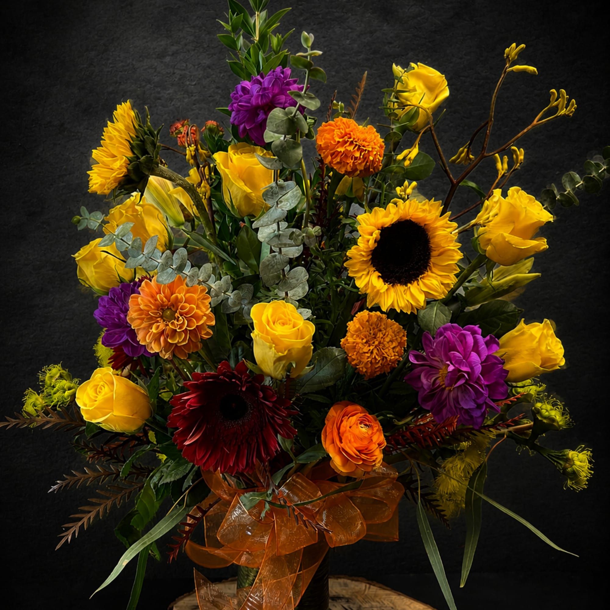 Sunflower-bright and full of cheer, this tall flower arrangement puts yellow roses