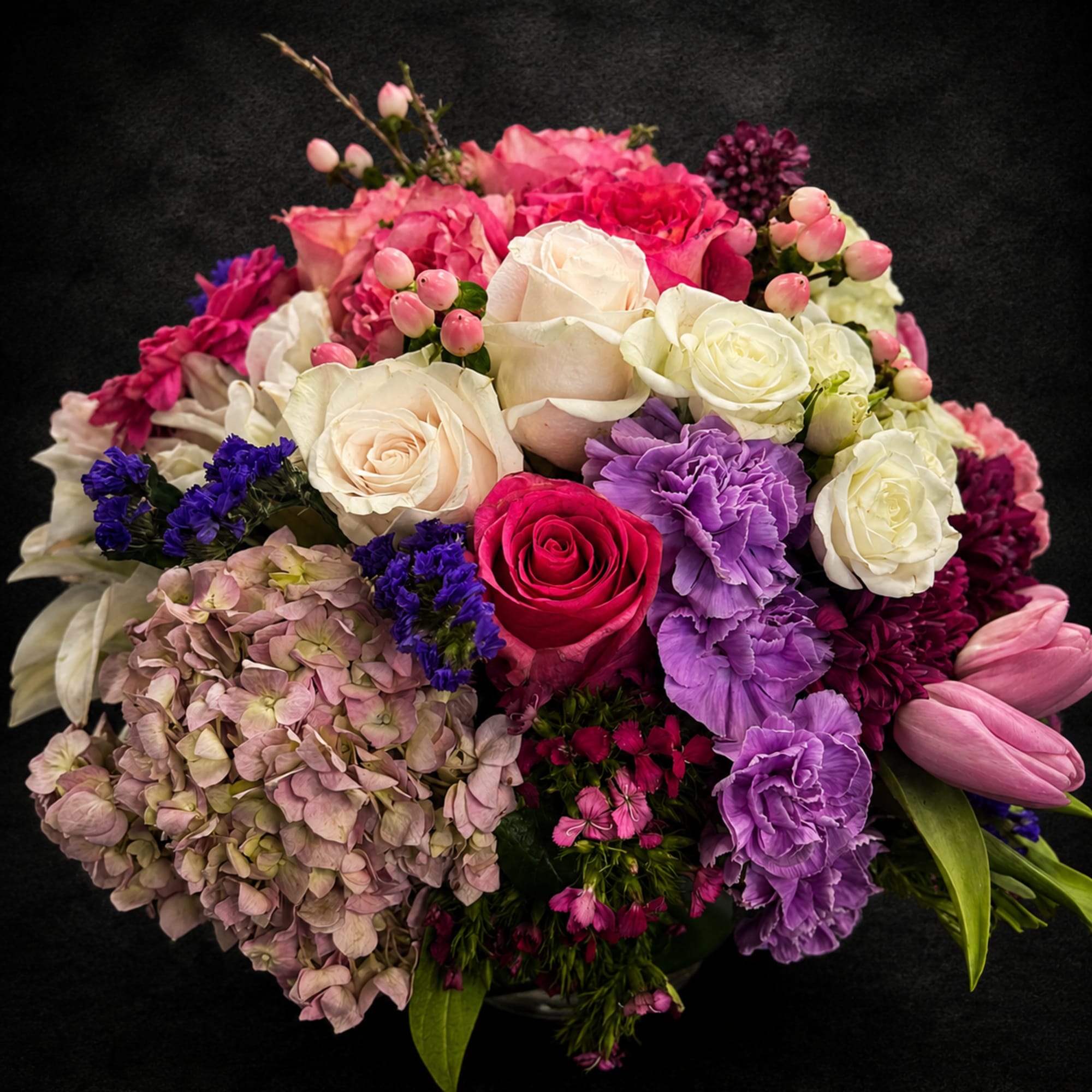 A vibrant, mixed-color Designer's Choice flower arrangement that makes a joyful anniversary