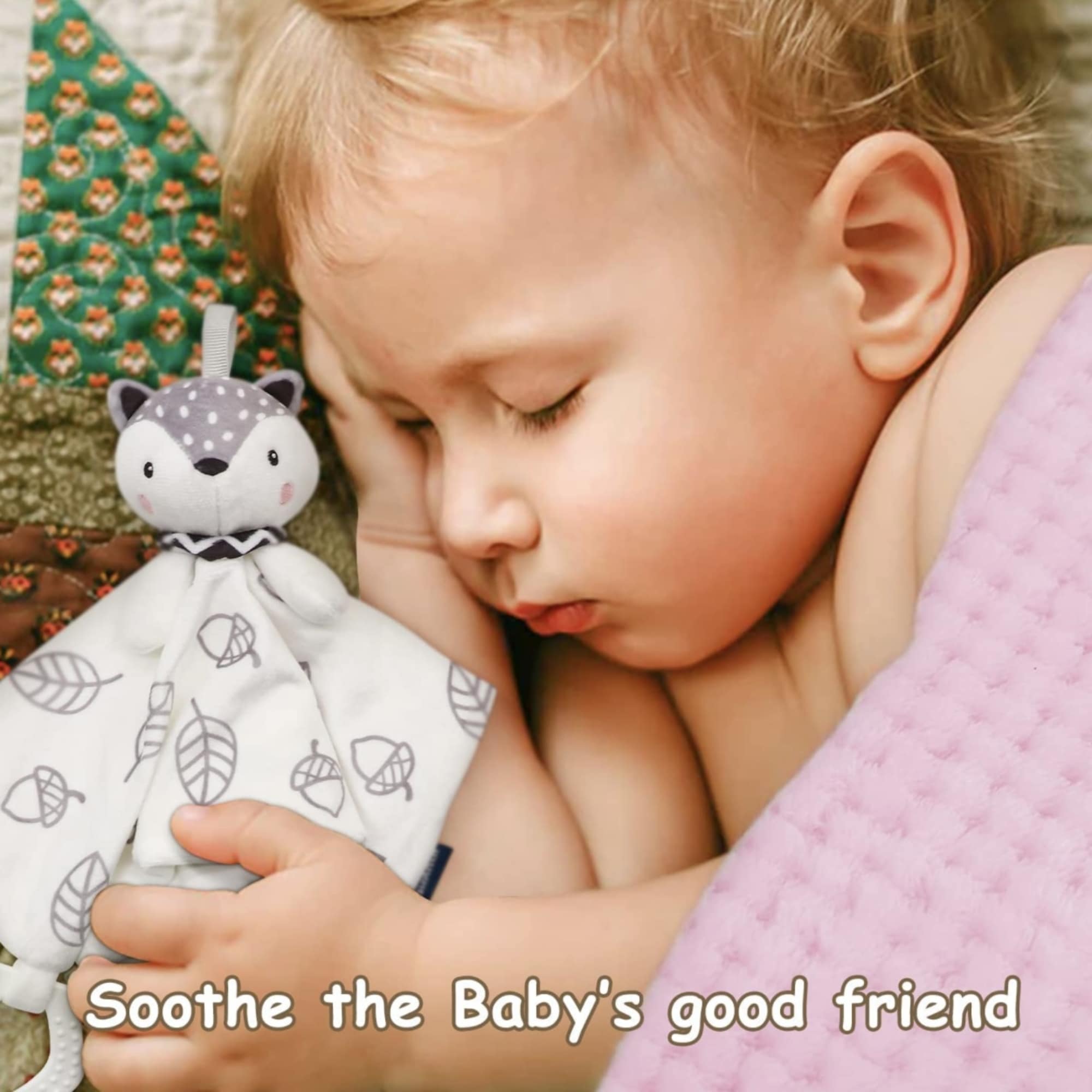 Sleeping baby cuddling a plush fox security blanket
