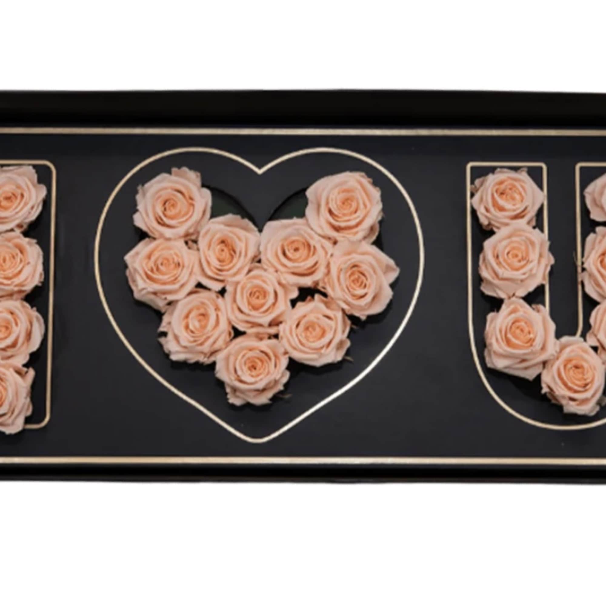 Black tray with peach roses arranged as "I ♥ U"