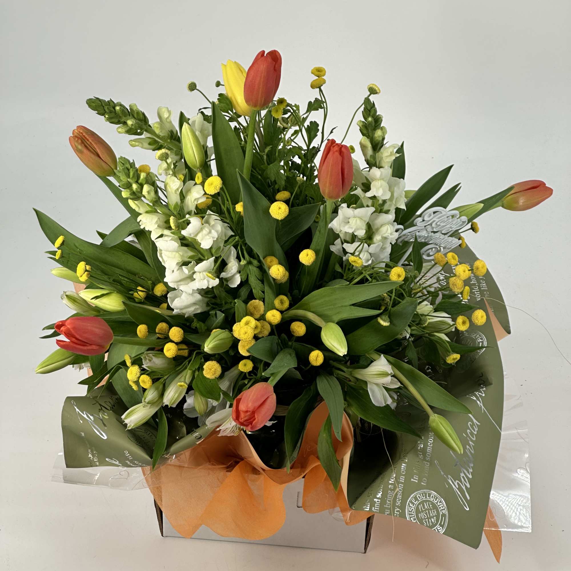 A designer-crafted arrangement featuring premium seasonal blooms ,thoughtfully styled and finished in