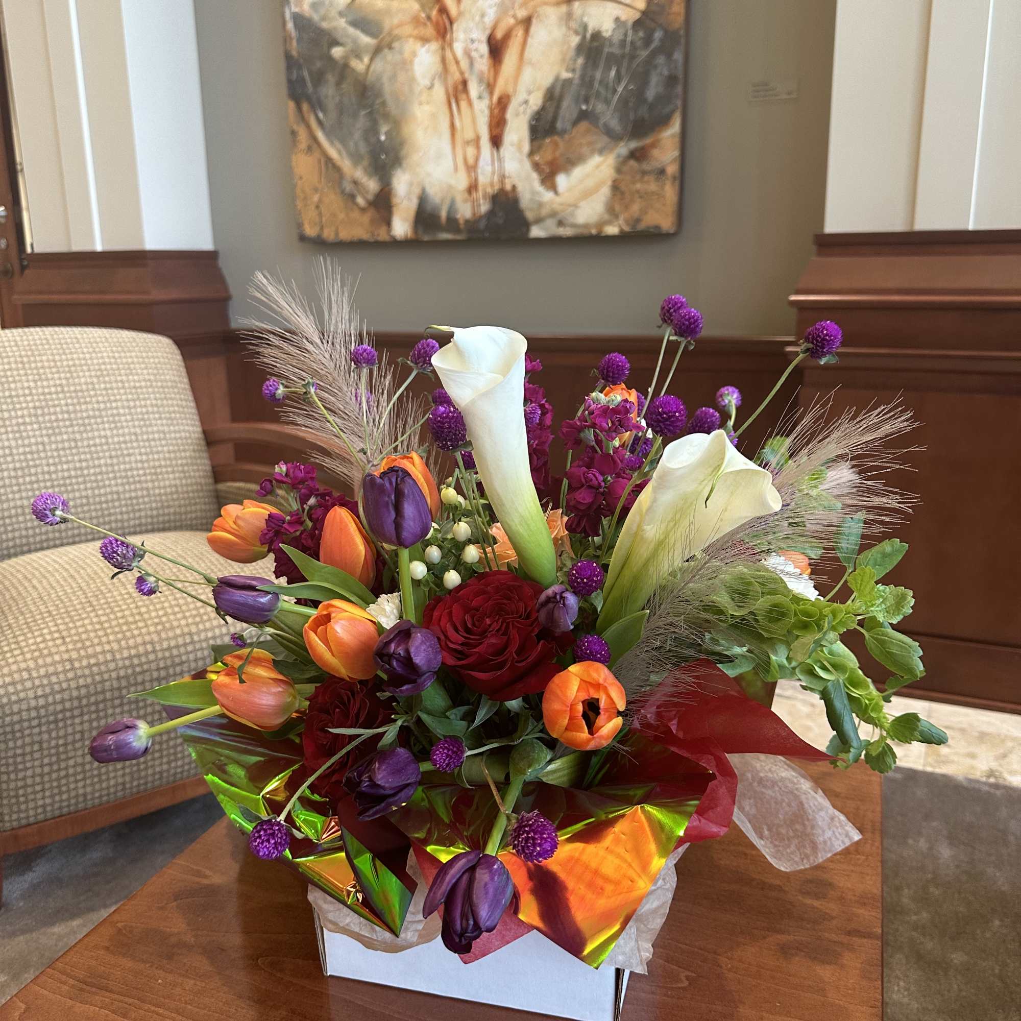 A designer-crafted arrangement featuring premium seasonal blooms ,thoughtfully styled and finished in