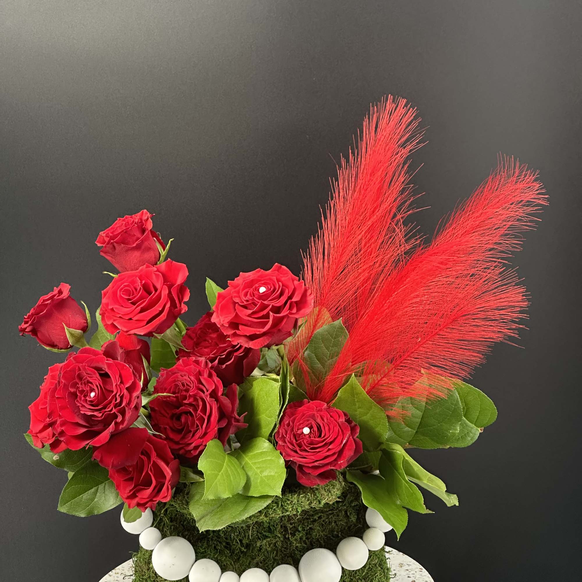 A designer-crafted arrangement featuring premium seasonal blooms ,thoughtfully styled and finished in