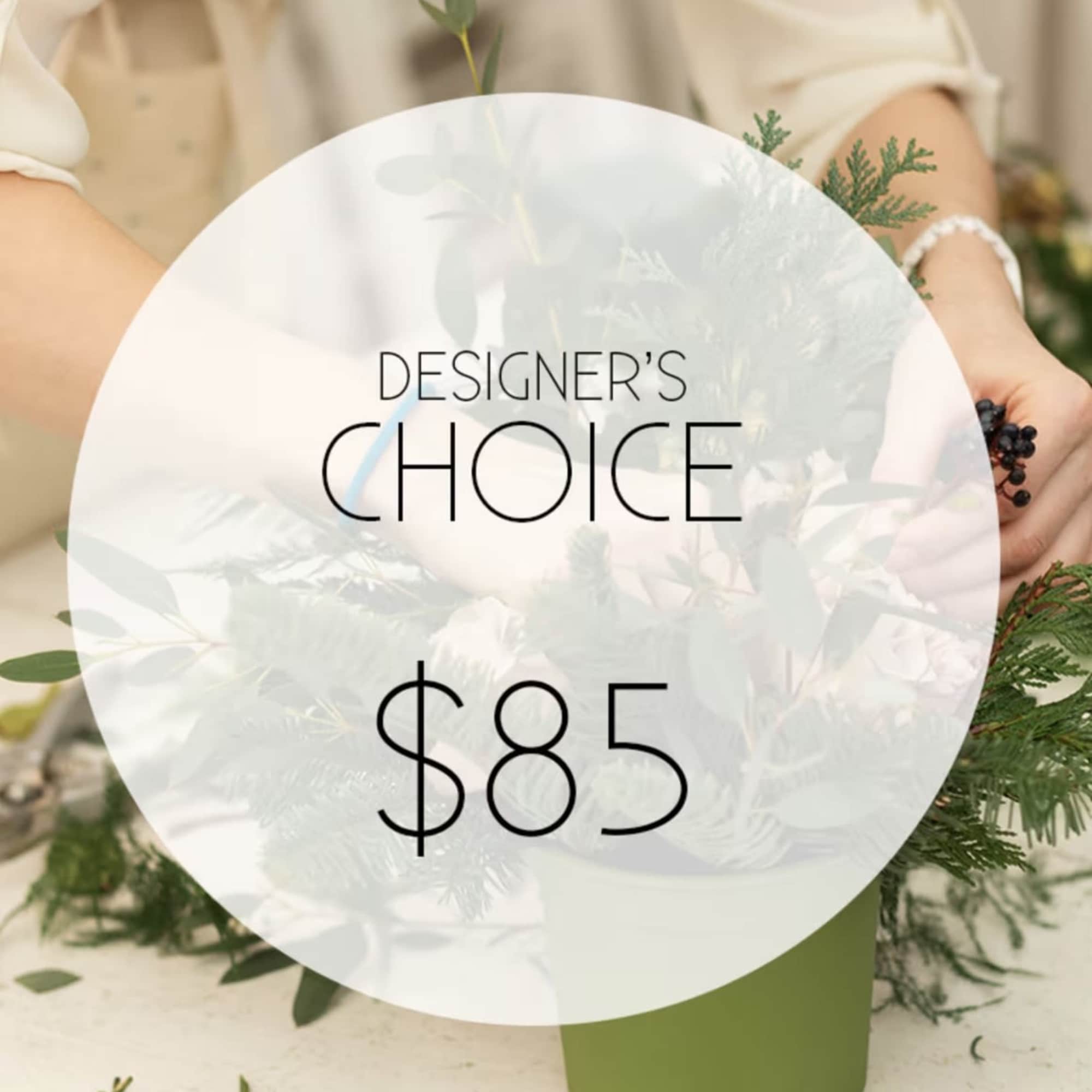 A designer-crafted arrangement featuring premium seasonal blooms ,thoughtfully styled and finished in