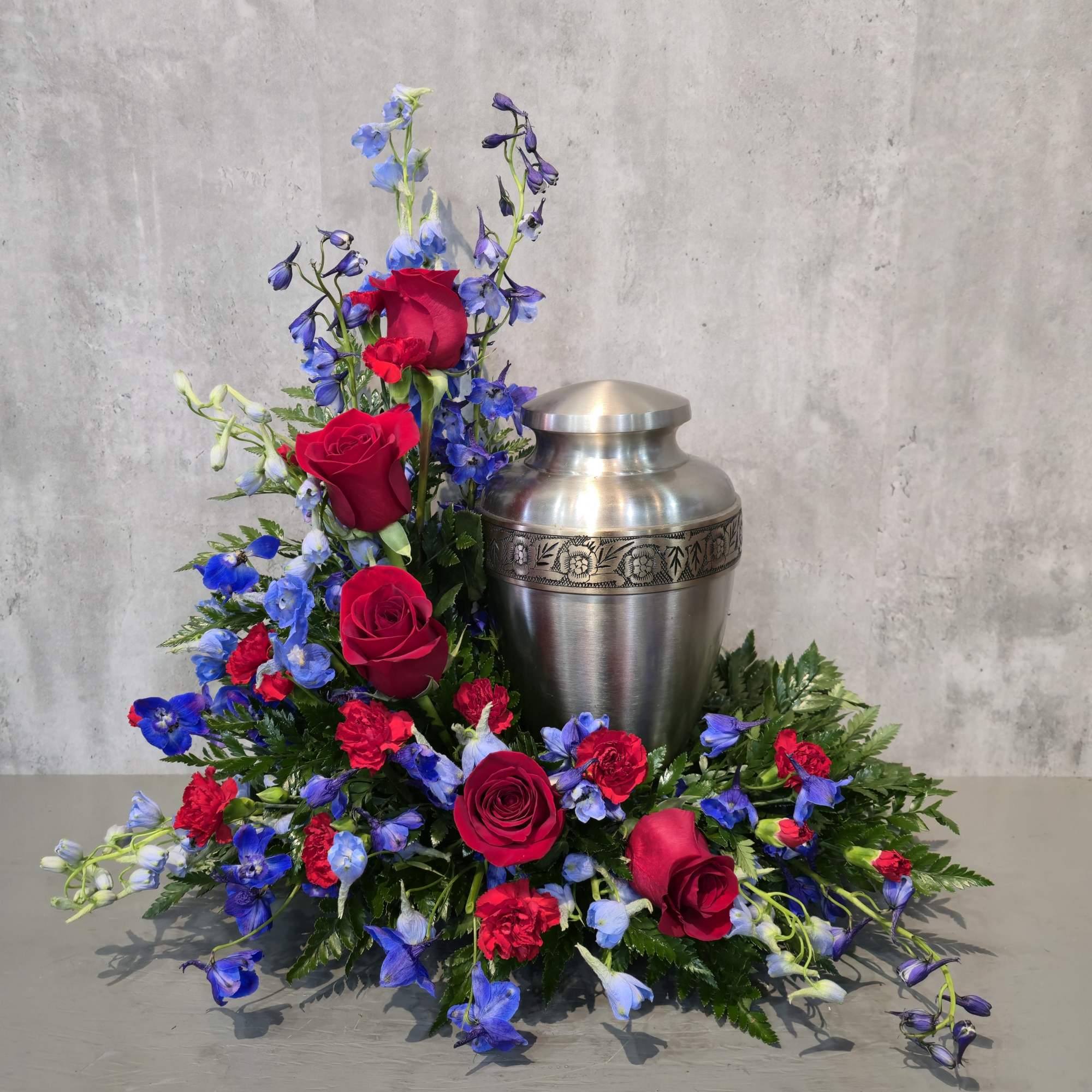 A simple and delicate urn spray. This arrangement is only available for