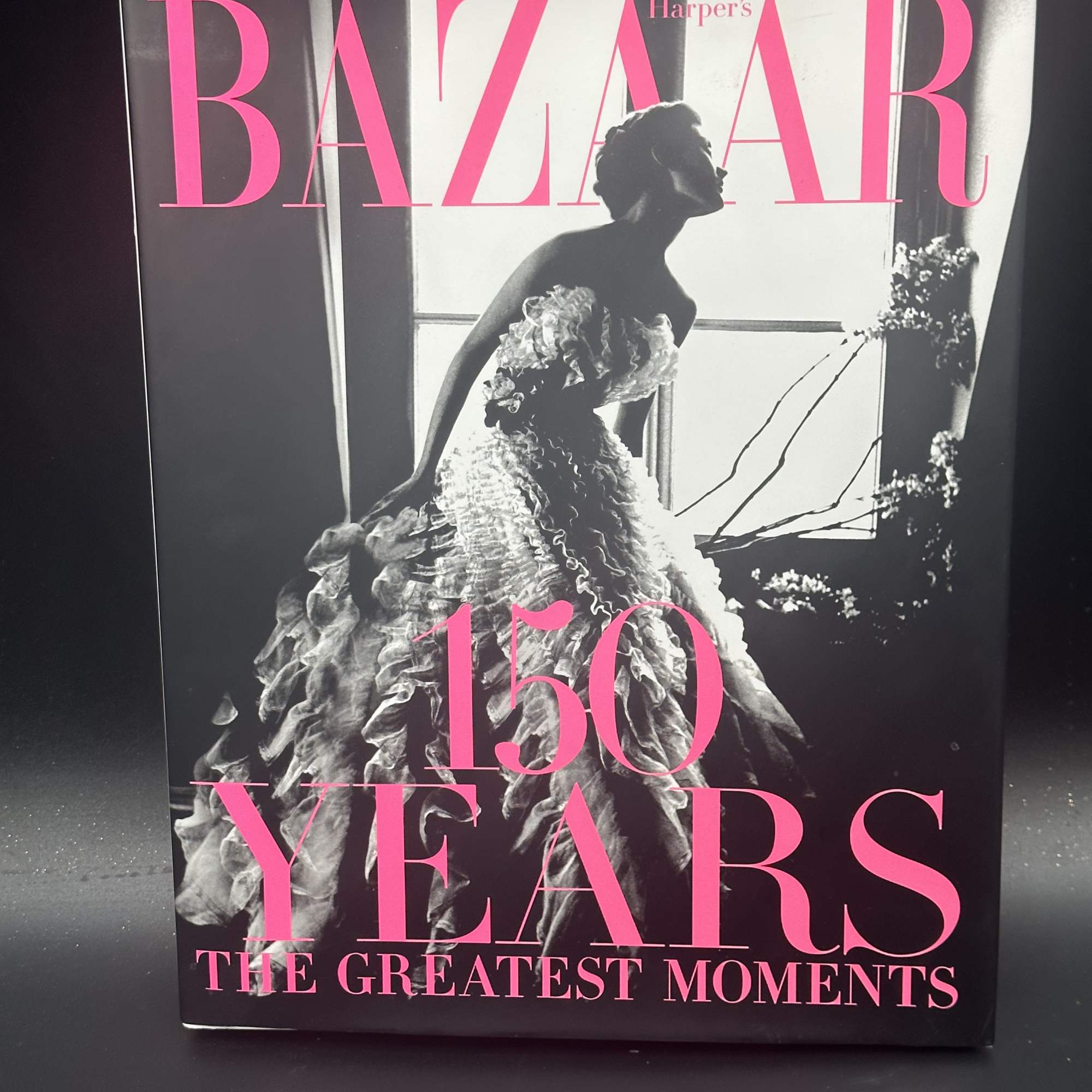 Harper's Bazaar 150 Years magazine cover with a black-and-white fashion portrait