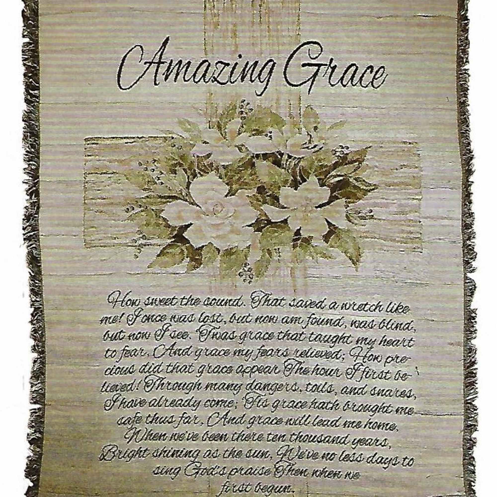 Decorative wall hanging with white flowers and the words Amazing Grace