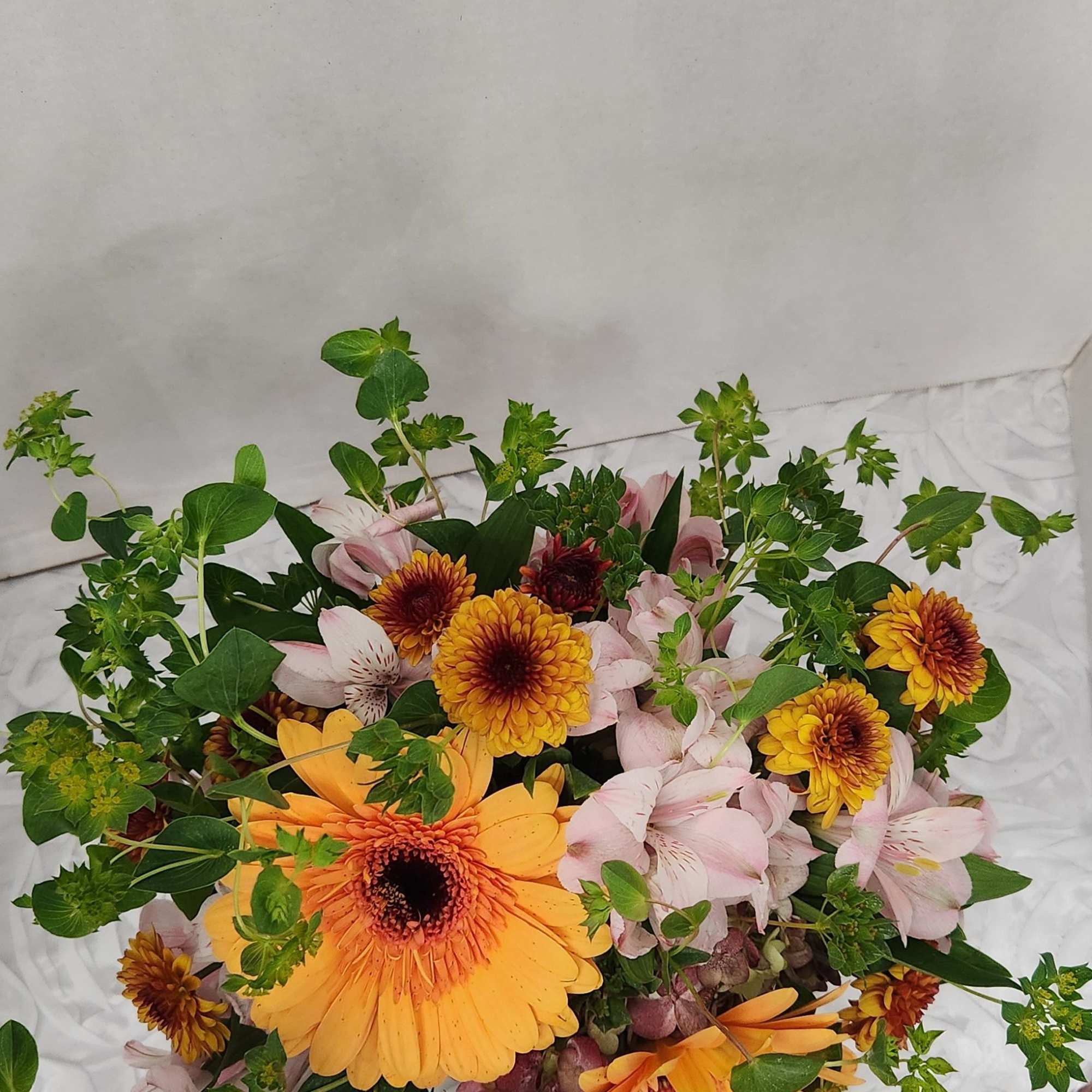 This cute little arrangement comes in a faux flower pot. Your special