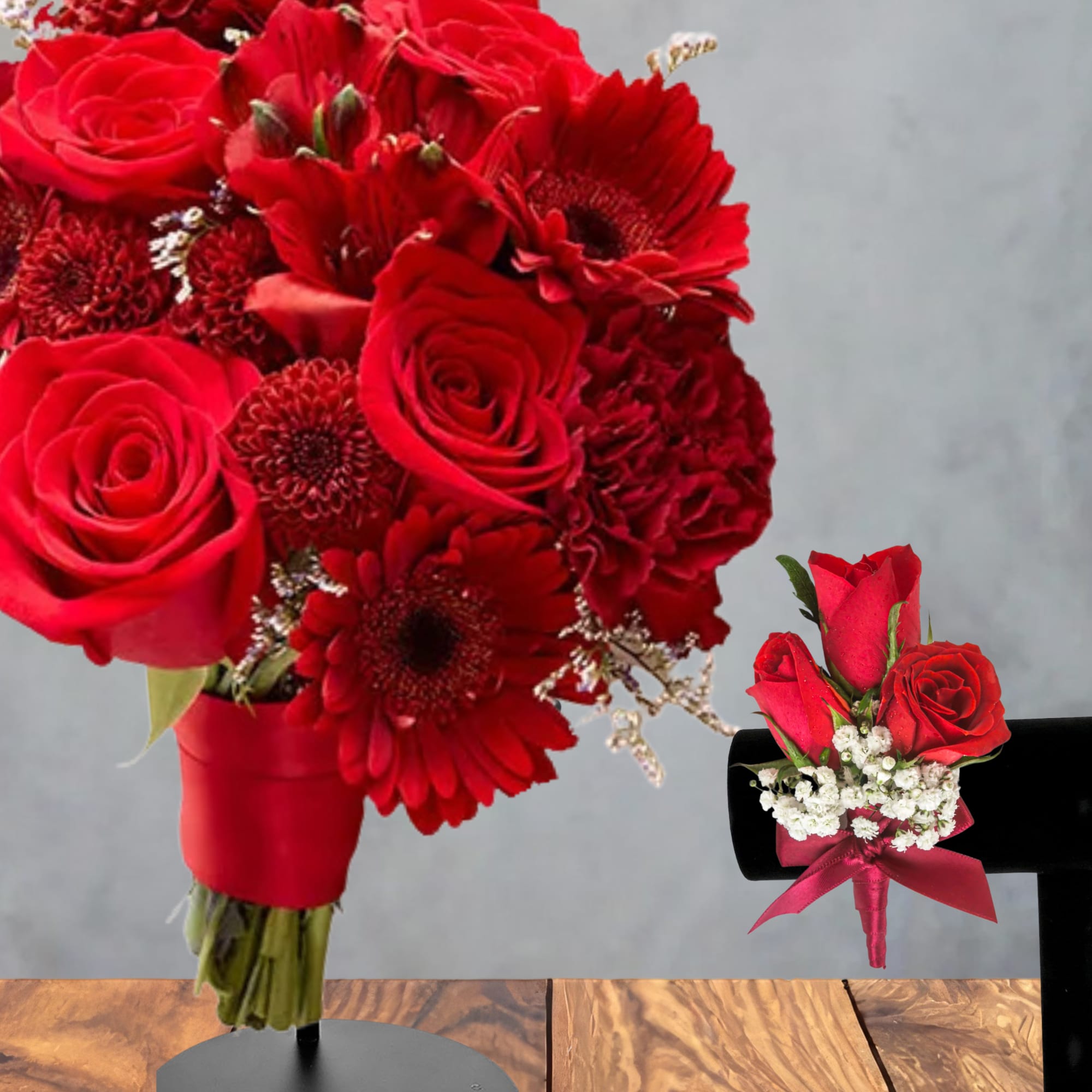 Red rose and gerbera daisy bouquet with a small matching boutonniere