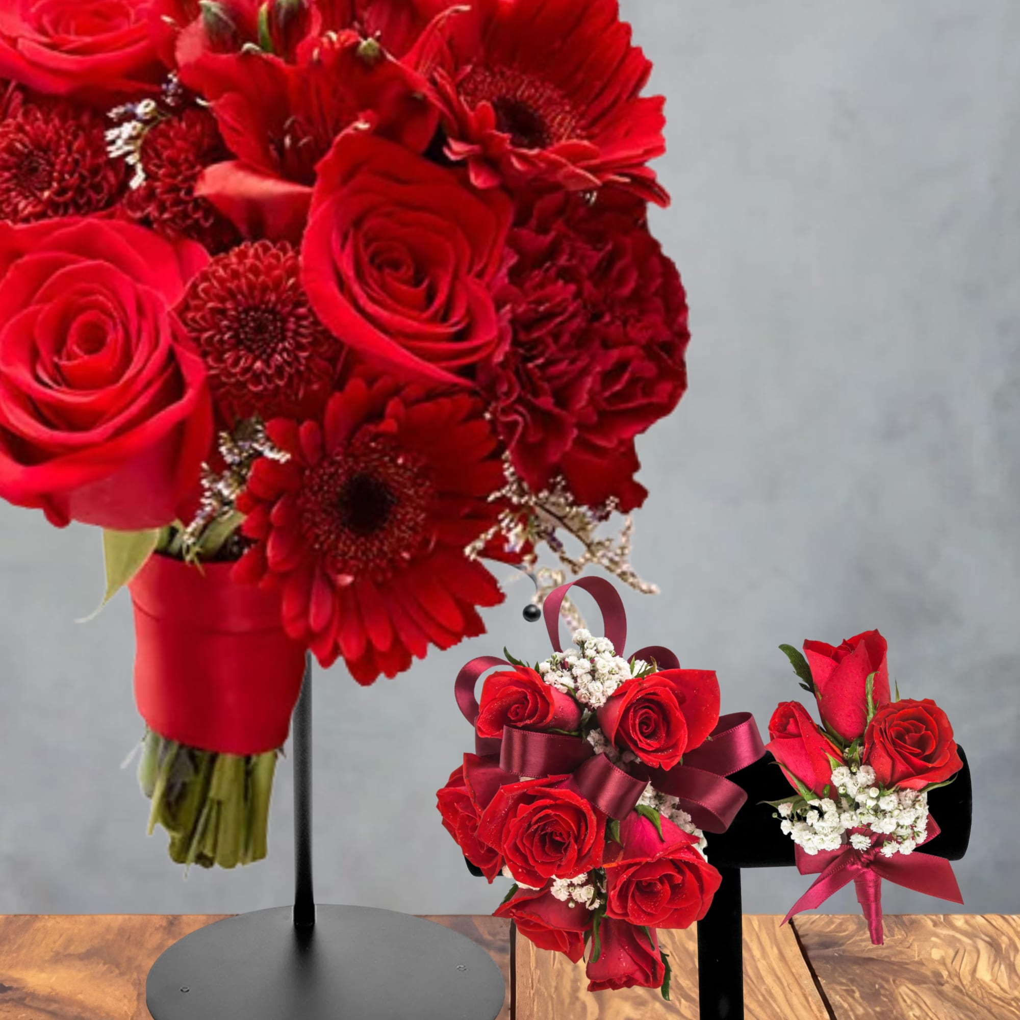 Red rose and gerbera bouquets on black stands