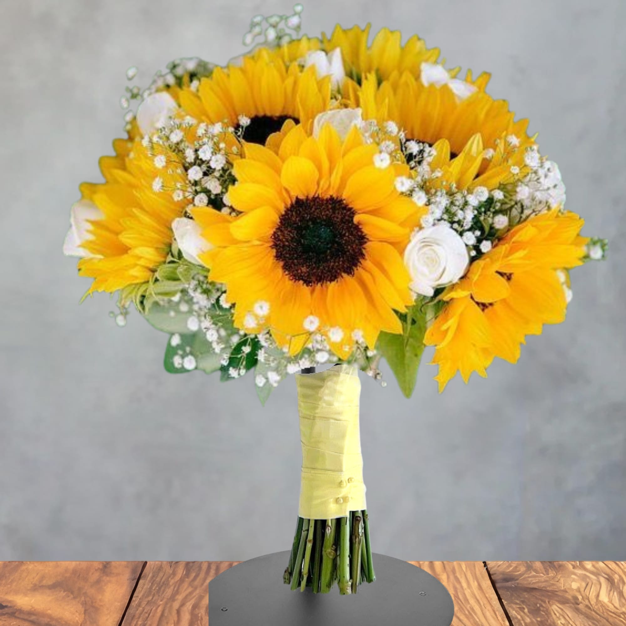 Bouquet of yellow sunflowers with white accent flowers
