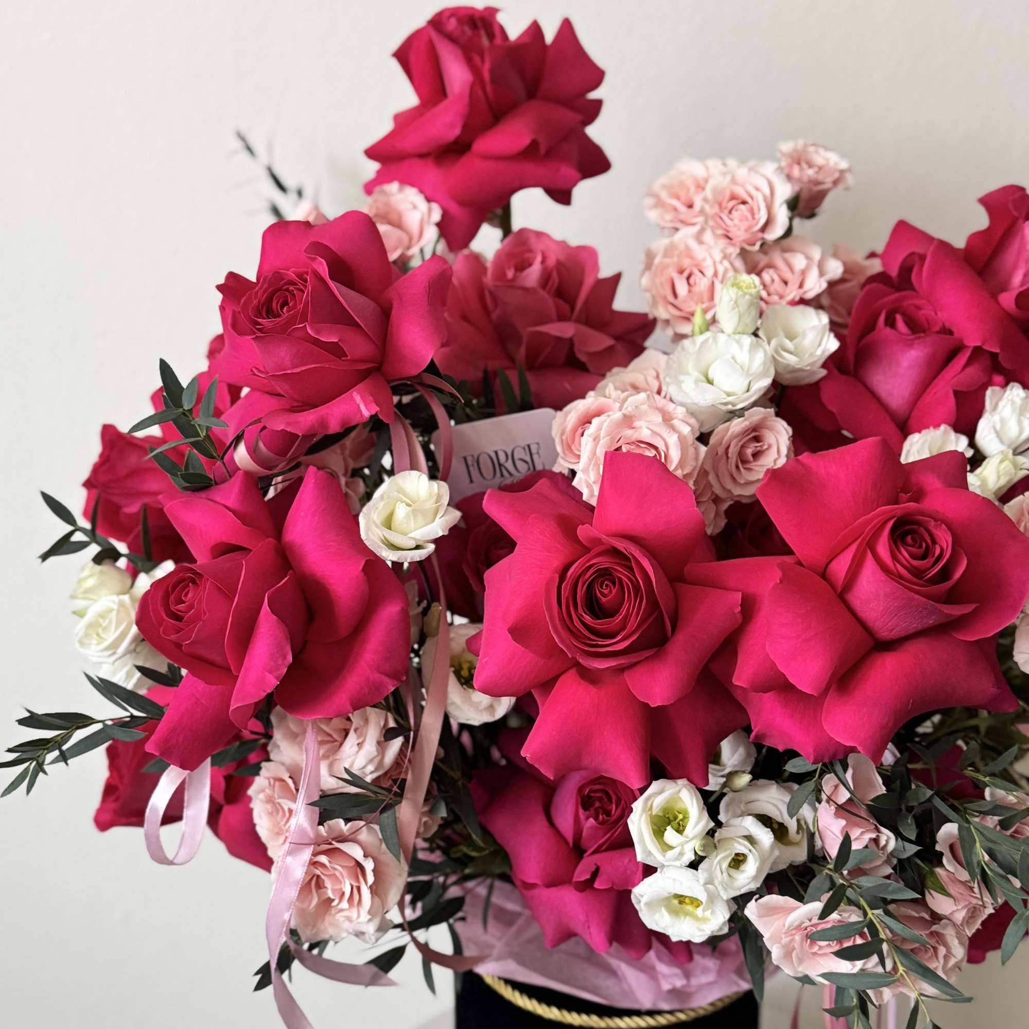 A bold, glam hatbox arrangement packed with hot pink roses, soft blush, photo 2 of 3