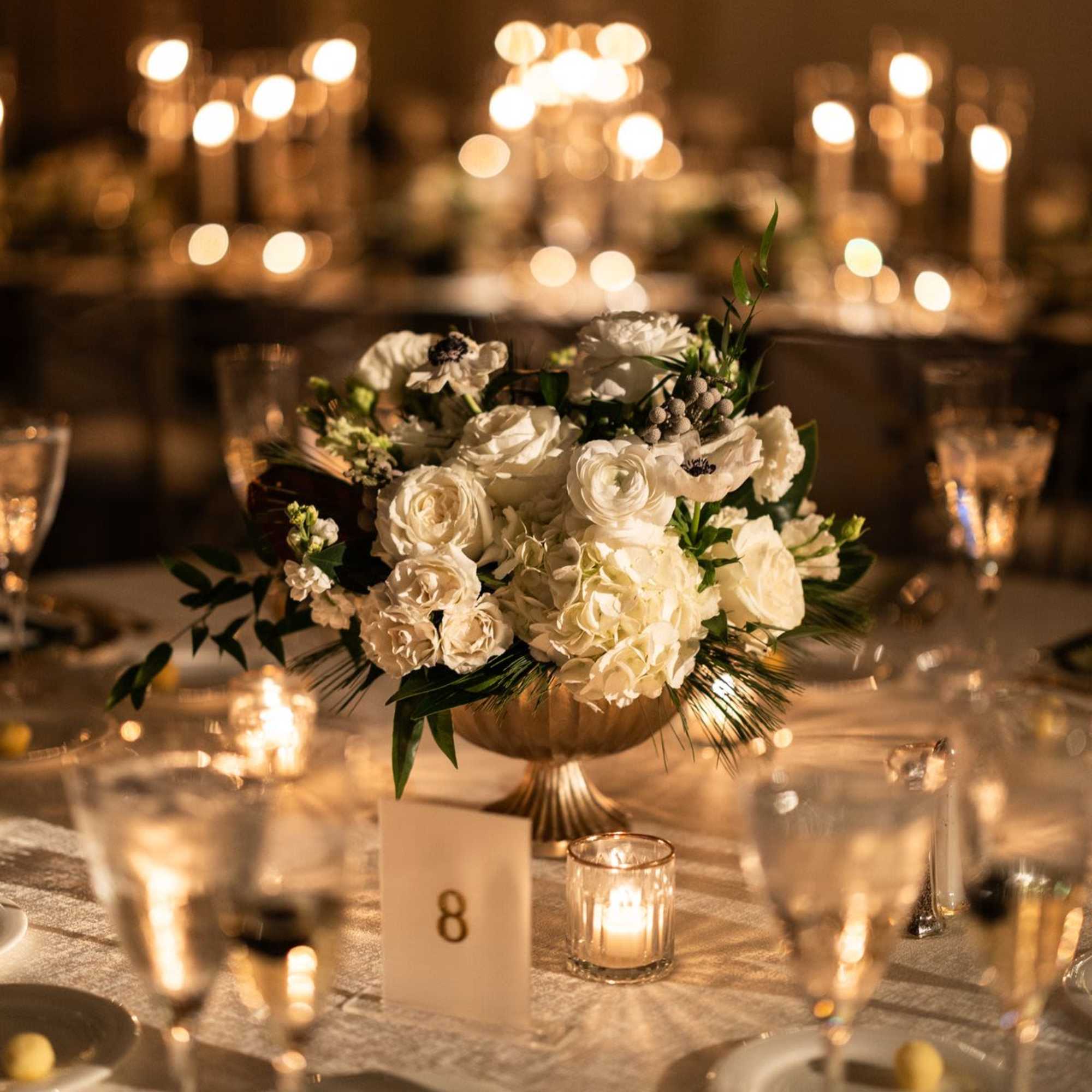 A low, classic wedding centerpiece designed to feel timeless, romantic, and guest-friendly, photo 2 of 2
