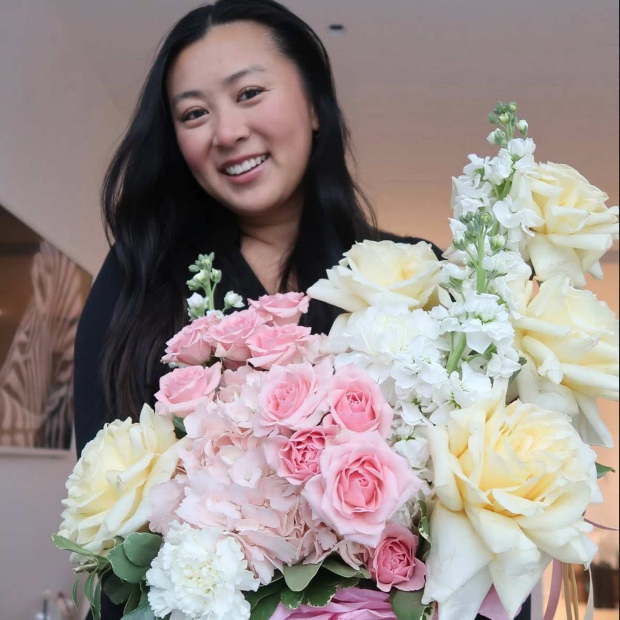 A soft, romantic arrangement in dreamy shades of blush pink and buttery