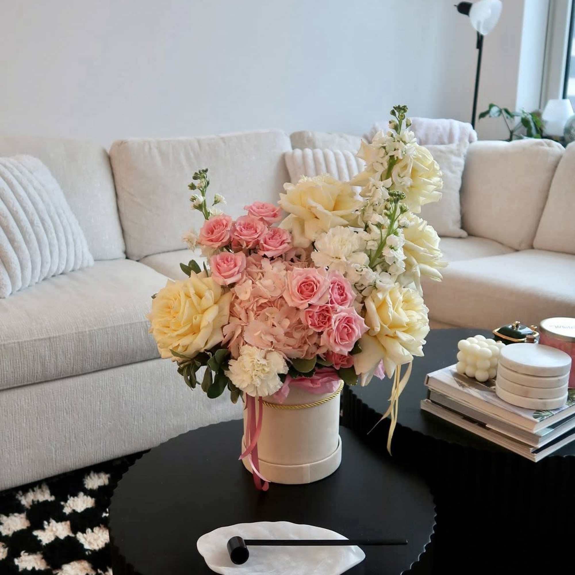A soft, romantic arrangement in dreamy shades of blush pink and buttery