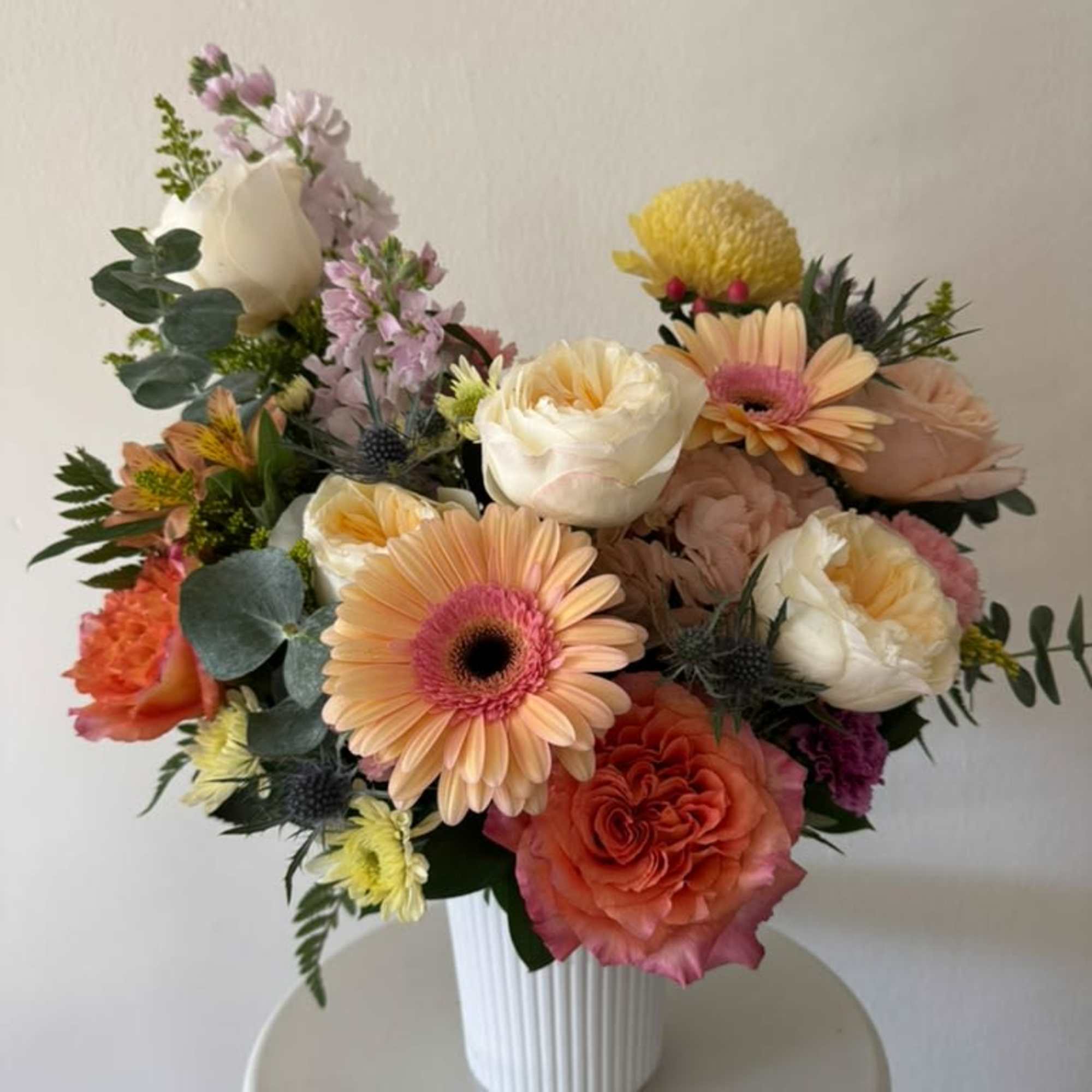 Colorful mix of flowers in a vas. perfect for any occasion. 