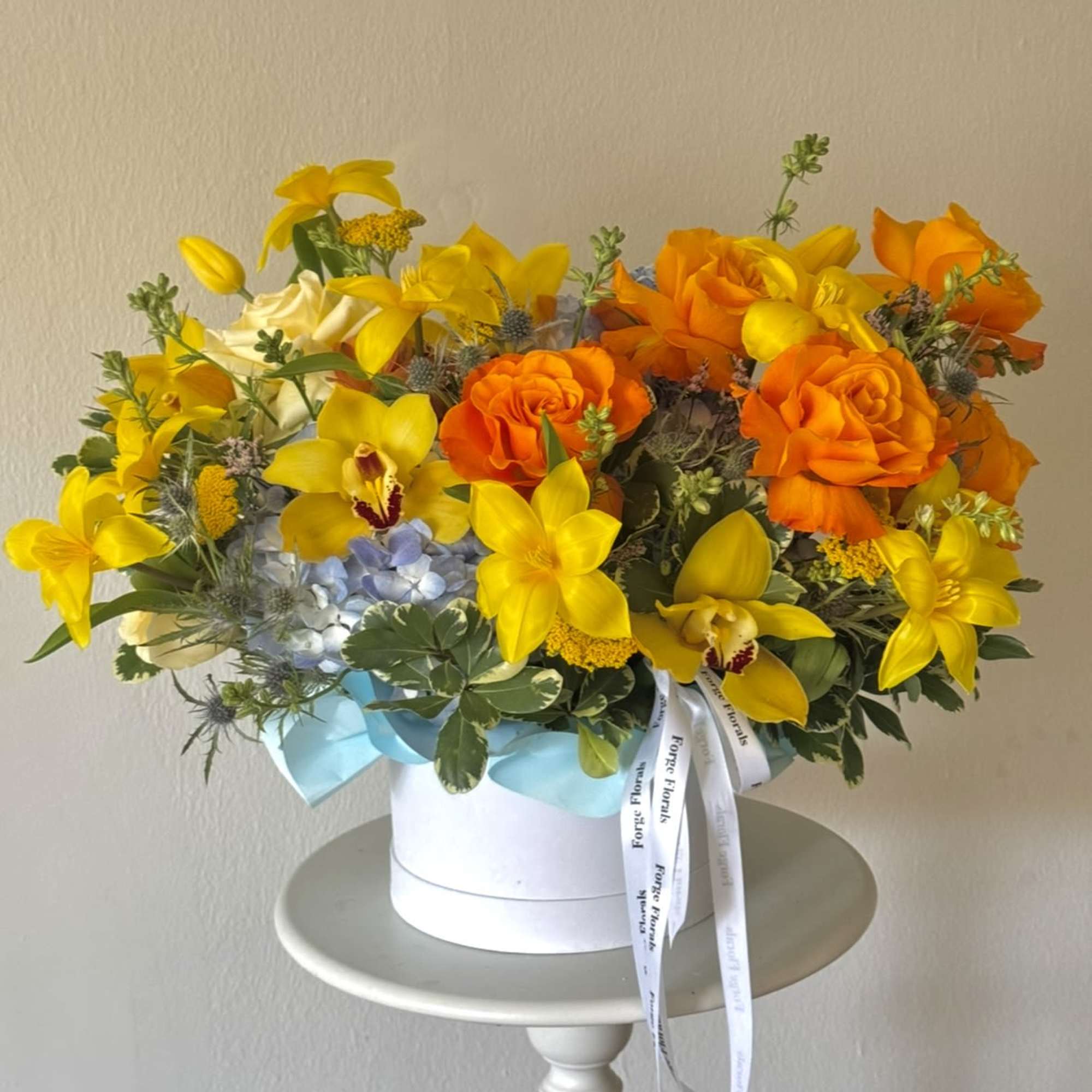 A vibrant and joyful design bursting with golden orchids, sunny tulips, bright