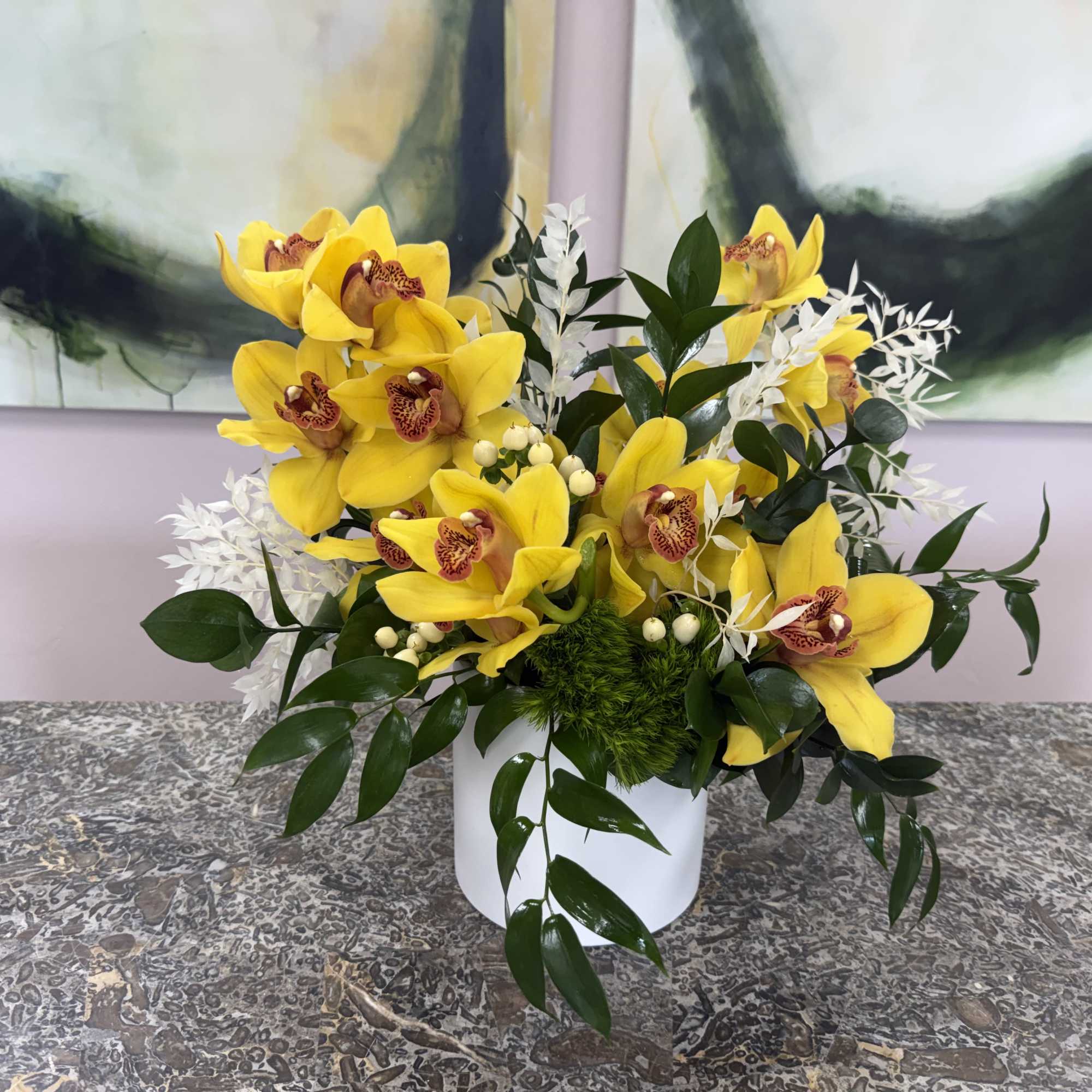 Clusters of bright yellow orchids with speckled centers make a cheerful statement, photo 2 of 2